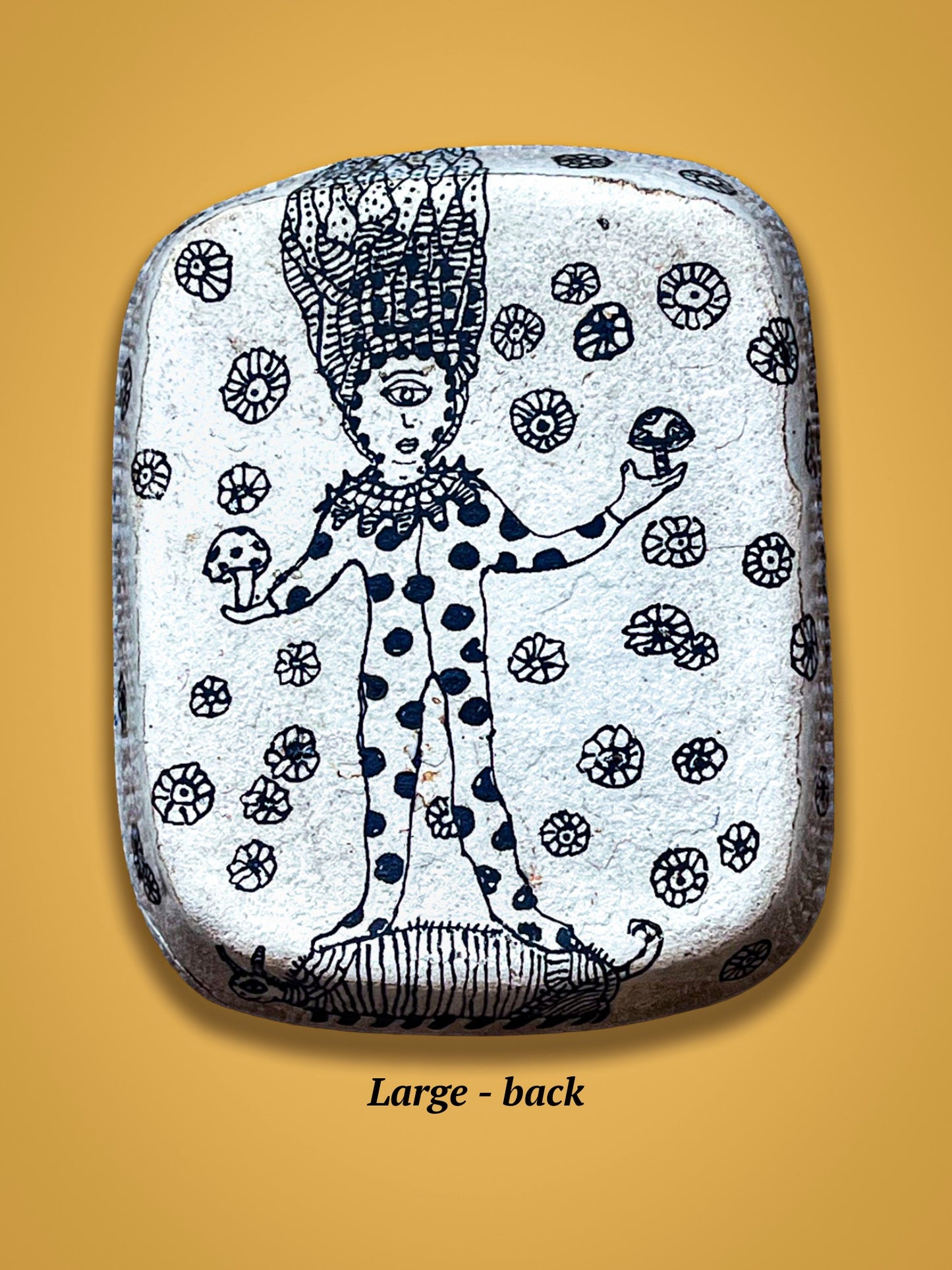 This is the back of the rectangular plate with black and white illustration of a person with a large head. The back has not been glazed with gloss.