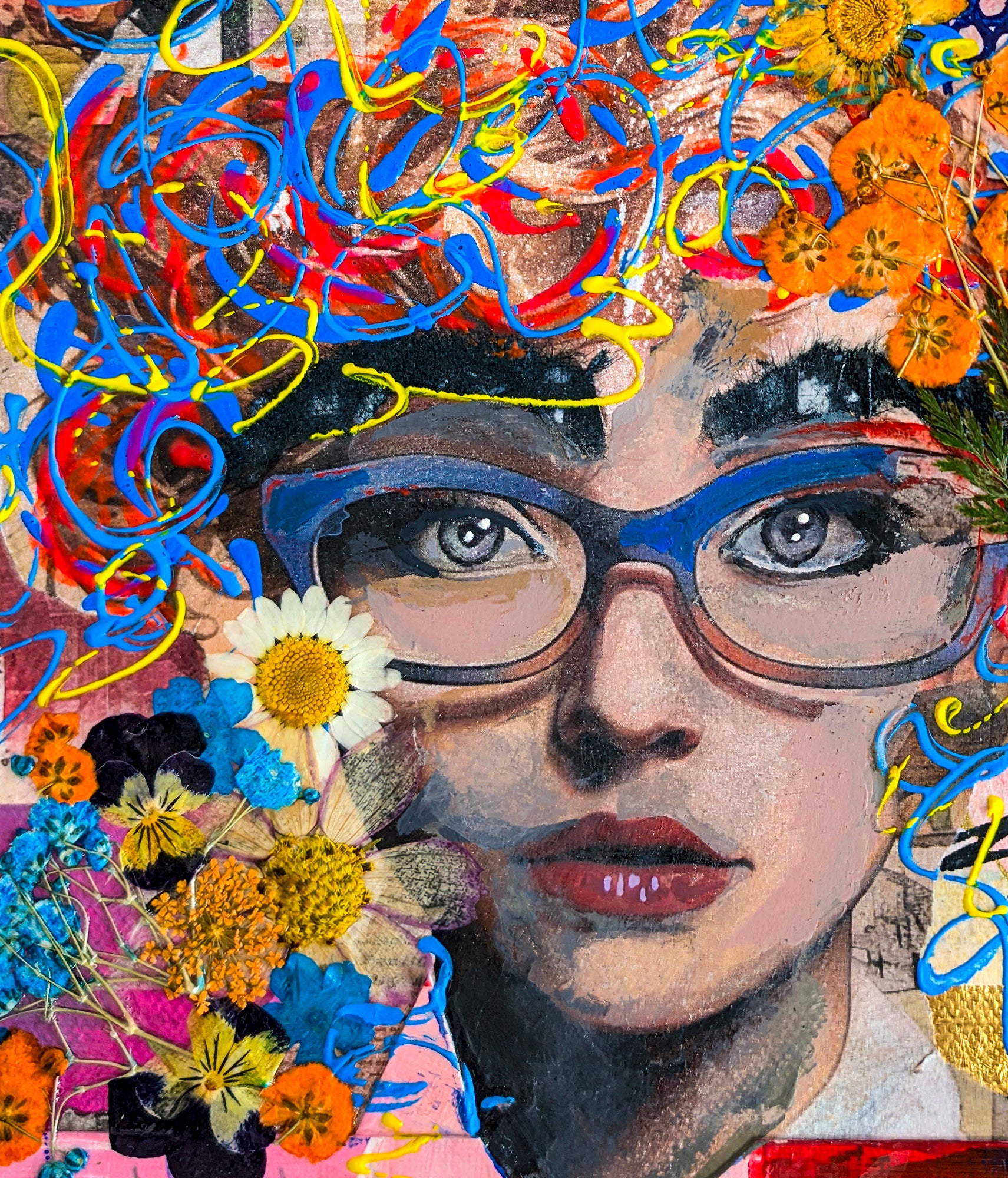 This is a close-up image of the girl in the piece. Her eyes shine clear and bright through the lens of her blue glasses. Her hair is a tangle of flowers, "strings" of paint and patterned background.