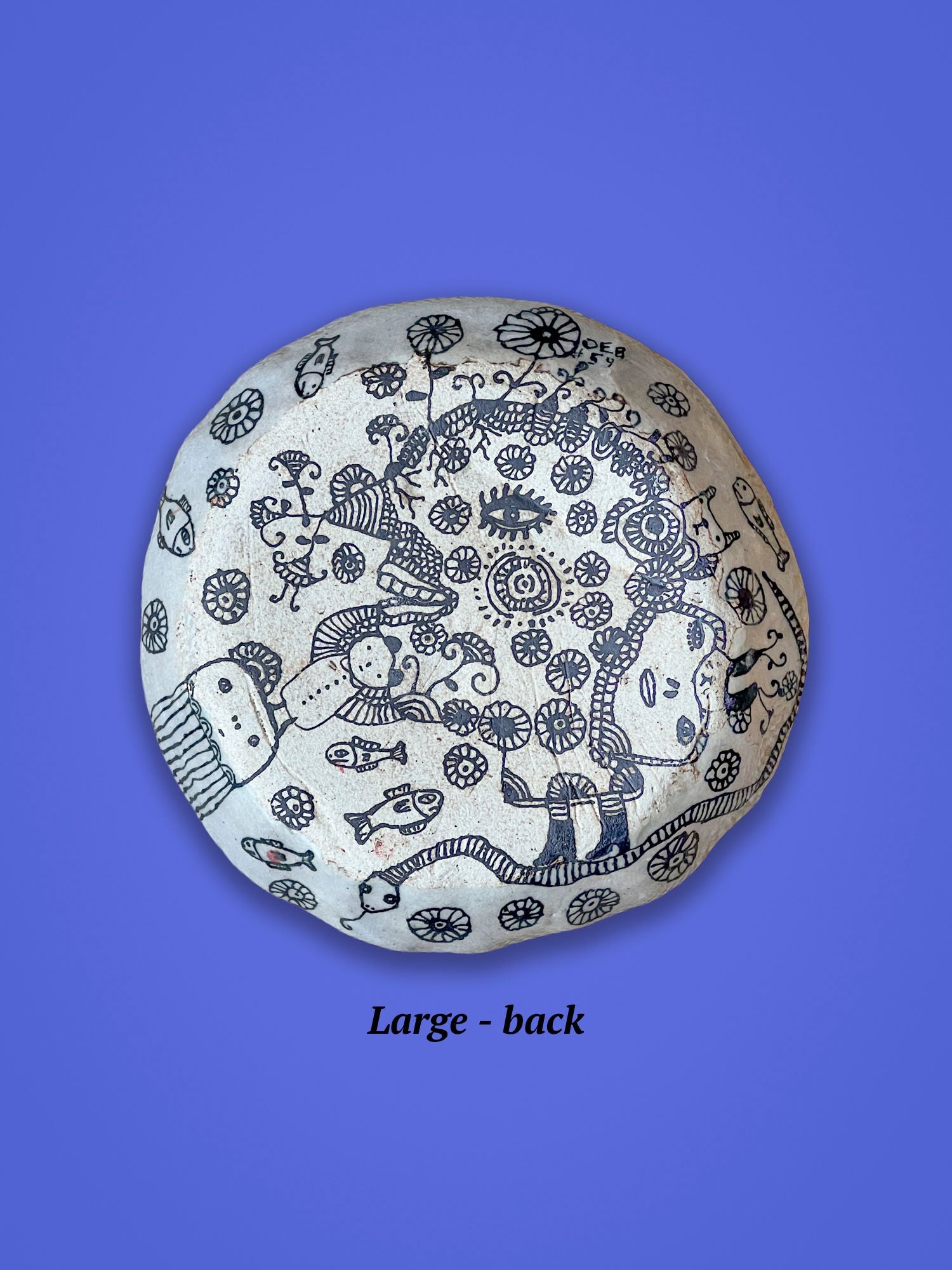 This is the backside of the previous piece. It is a matte surface as compared to glossy on the other side. It has similar intricate black designs.