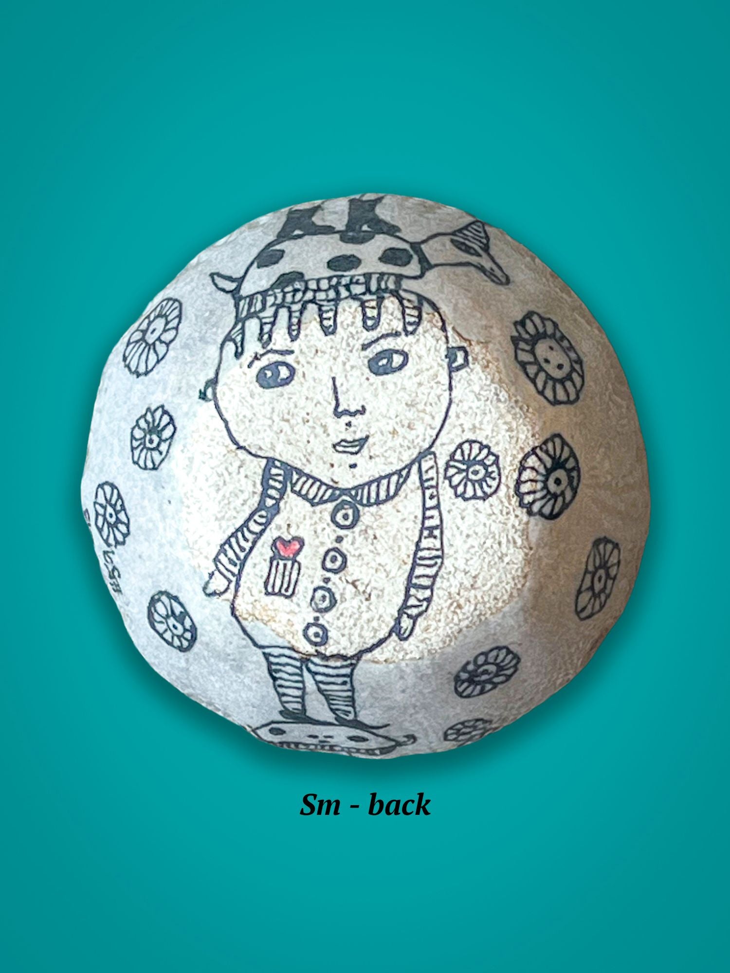 This is the back of the previous bowl. It has an image of a small boy with a turtle on his head and a small red heart in his pocket. It is matte texture in contrast to the front's glossy shine.
