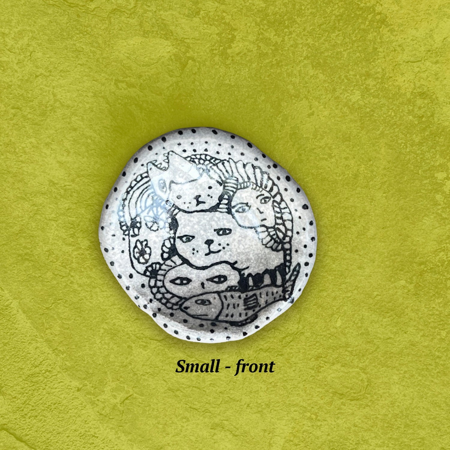 Small round bowl with cat illustration in black and white.