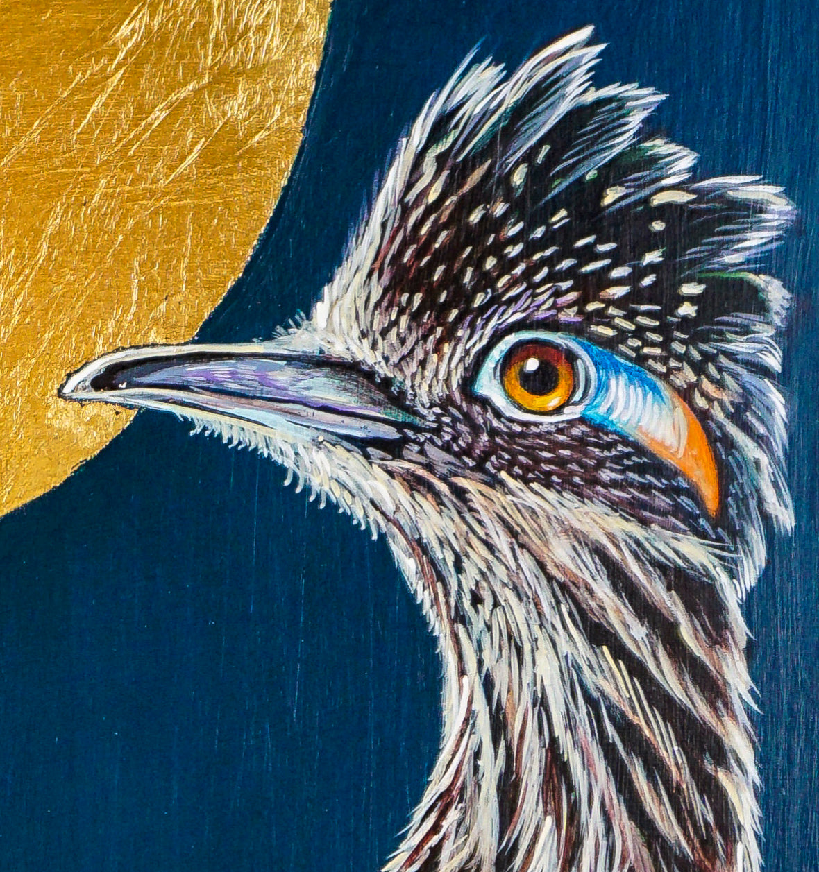 Acrylic painting of roadrunner with two shades of blue background, gold and copper leafing, clay, gold and copper thumbtacks; closeup of head detail; artist Marie Lavallee; 12"Wx16"H