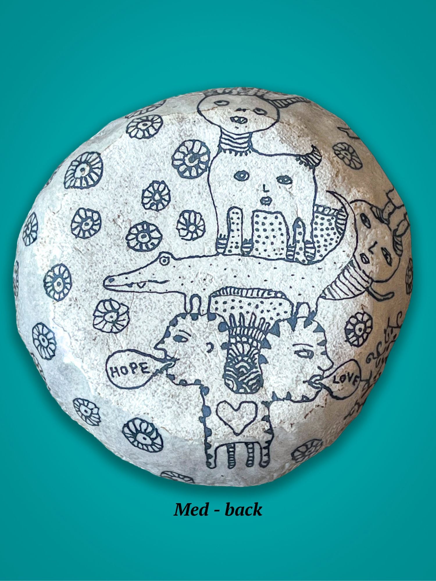 This is the back of the previous bowl. One of the figures looks like an alligator and another two headed figure shouts Hope and Love