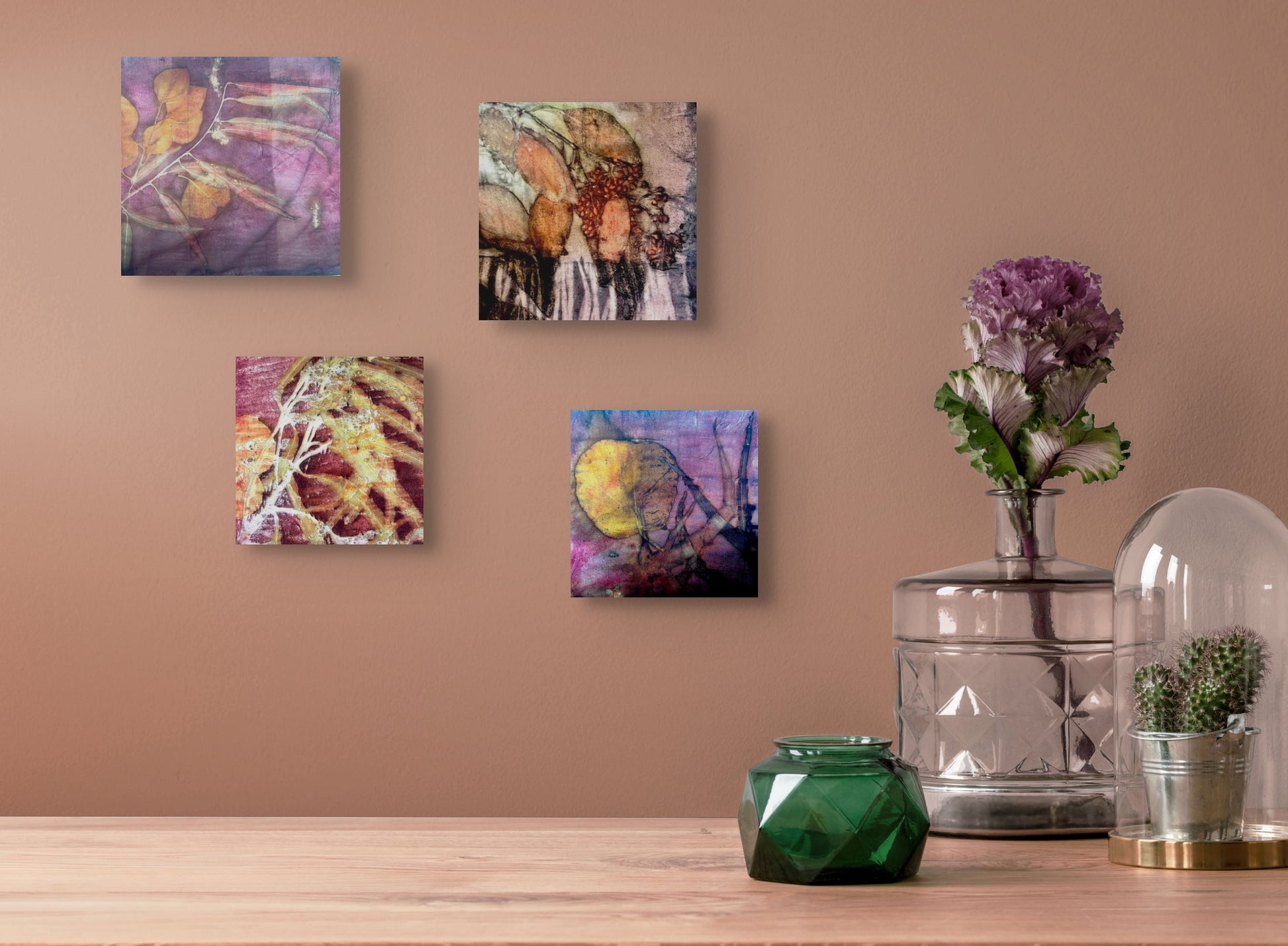 Series of four colorful blocks with colorful botanical prints; shown as a group hanging on wall in situ
