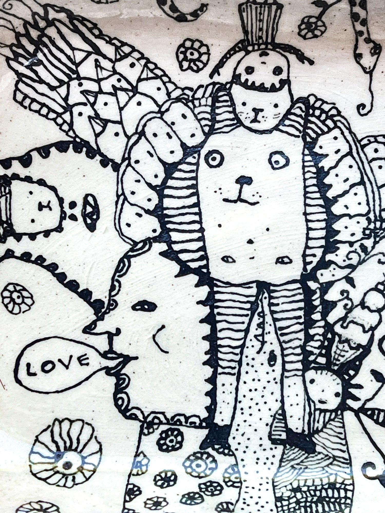 Black and white illustration of a bear character with decorative elements and 'LOVE' text. This is a zoomed in image.