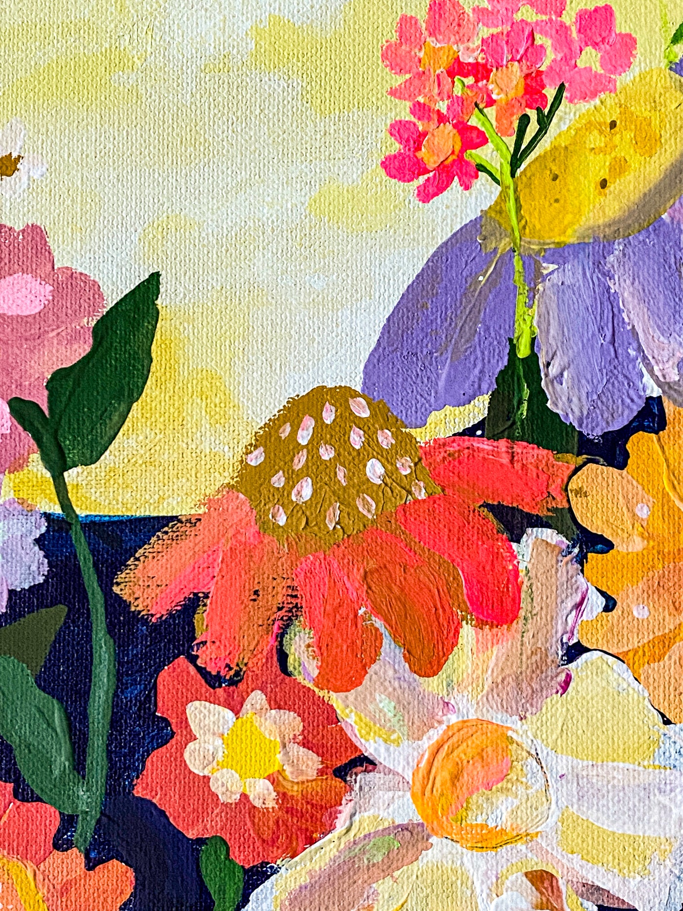 This is a close up image showing a variety of flowers on a textured background against the backdrop of the yellow moon.