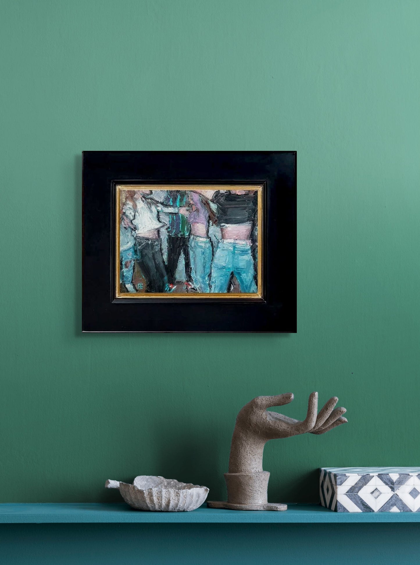 An impressionistic painting of dancing, youthful figures with odd shapes and patterns, using blues, blacks, and flesh tones; shown w/2" black wood frame hanging in situ on green wall
