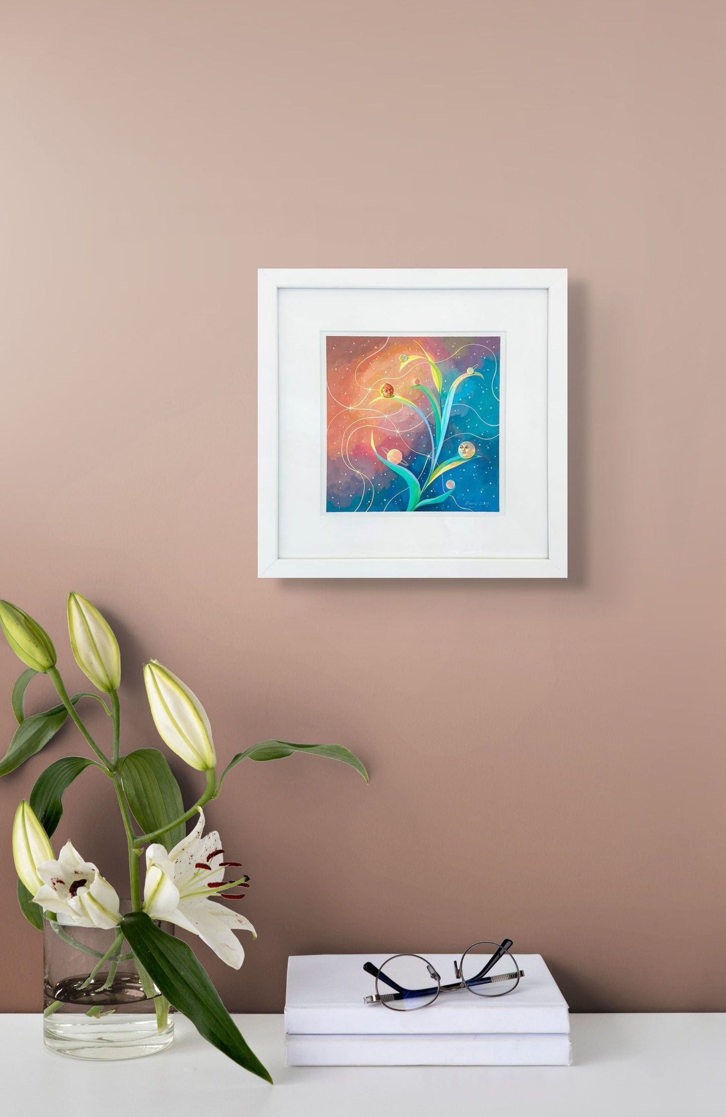 Planetary Phases in shown in situ on beige wall above table with flowers, books, and set of glasses; white mat and white frame; 12" x 12"