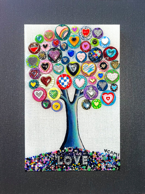 This fantastic piece shows a collection of handmade circles of clay in a myriad of colors. The circles, each with a design of a heart form to create a tree. At the base of the tree is the word love in white gemstones