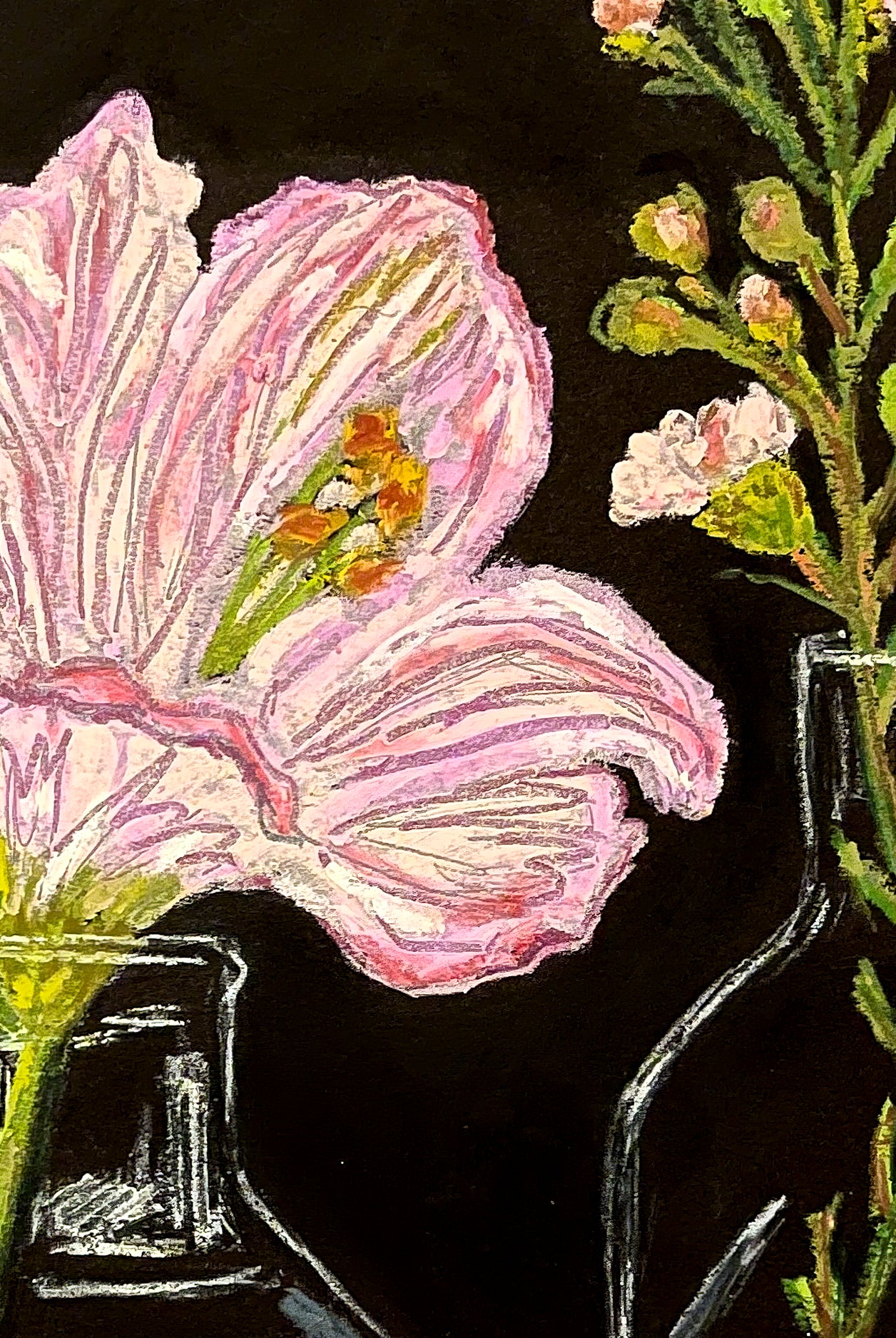 This close up image shows the details of pink flowers and green leaves on a black background. A stem of small buds is also shown. 