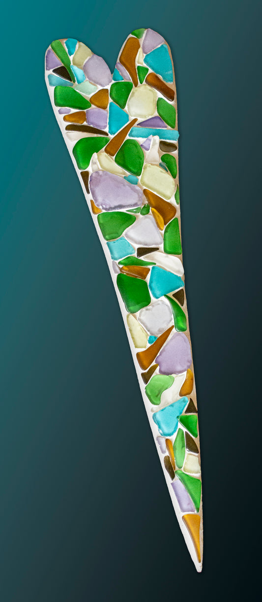 Long slender mosaic heart comprised exclusively of green, but, clear, and amber sea glass; artist Denise Marshall