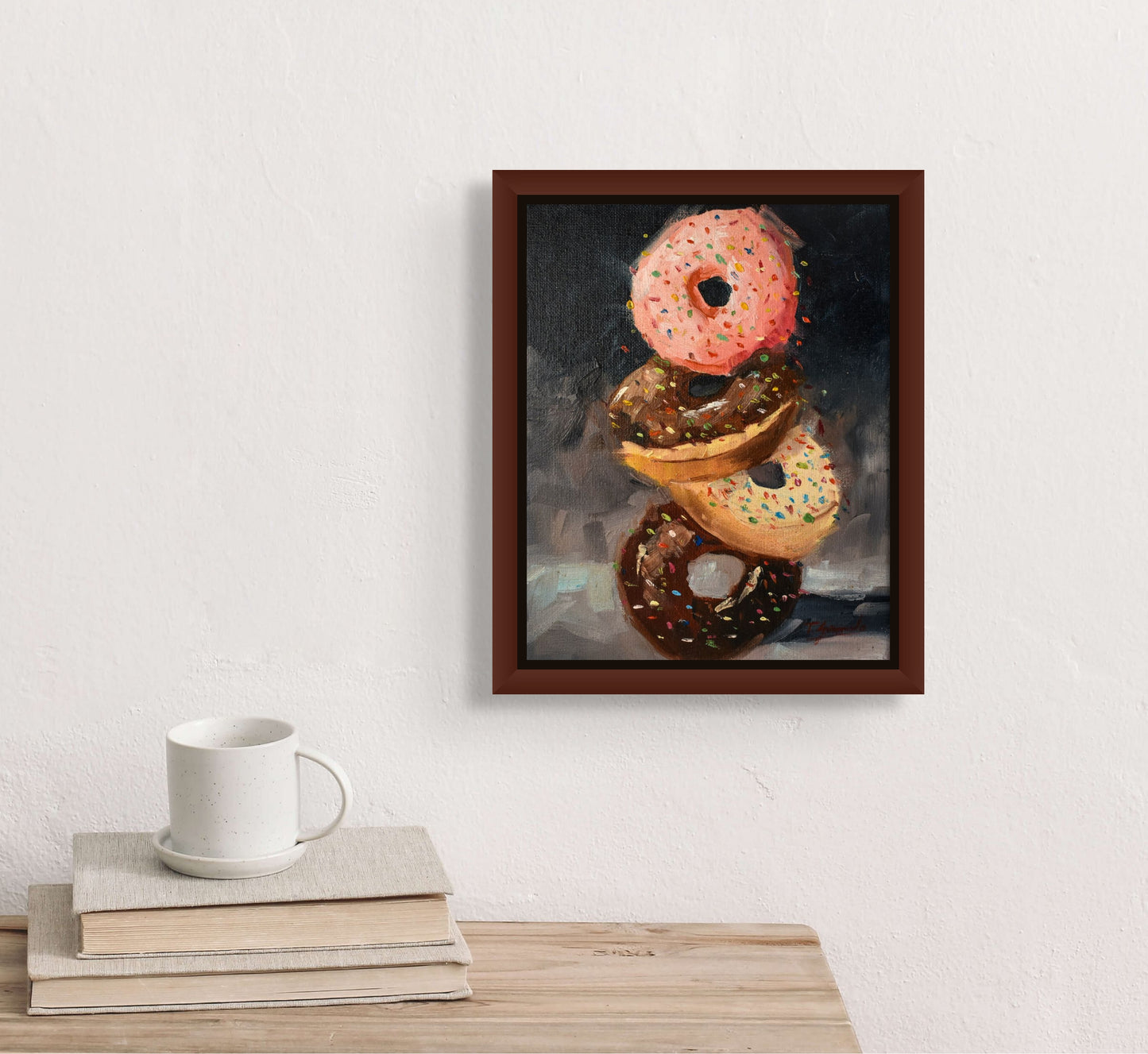 Four iced donuts balancing on one another. Donuts are strawberry, vanilla and chocolate sprinkles; shown in situ;  artist Teri Gammalo; 8"Wx10"H