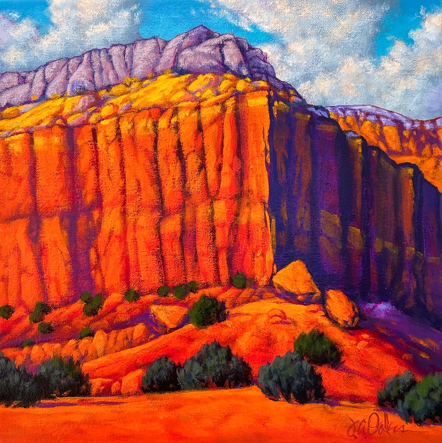 This image is signature Joe A. Oakes with his brilliant colors of orange, purples, blues and greens. It shows a large rock formation in the southwestern landscape.