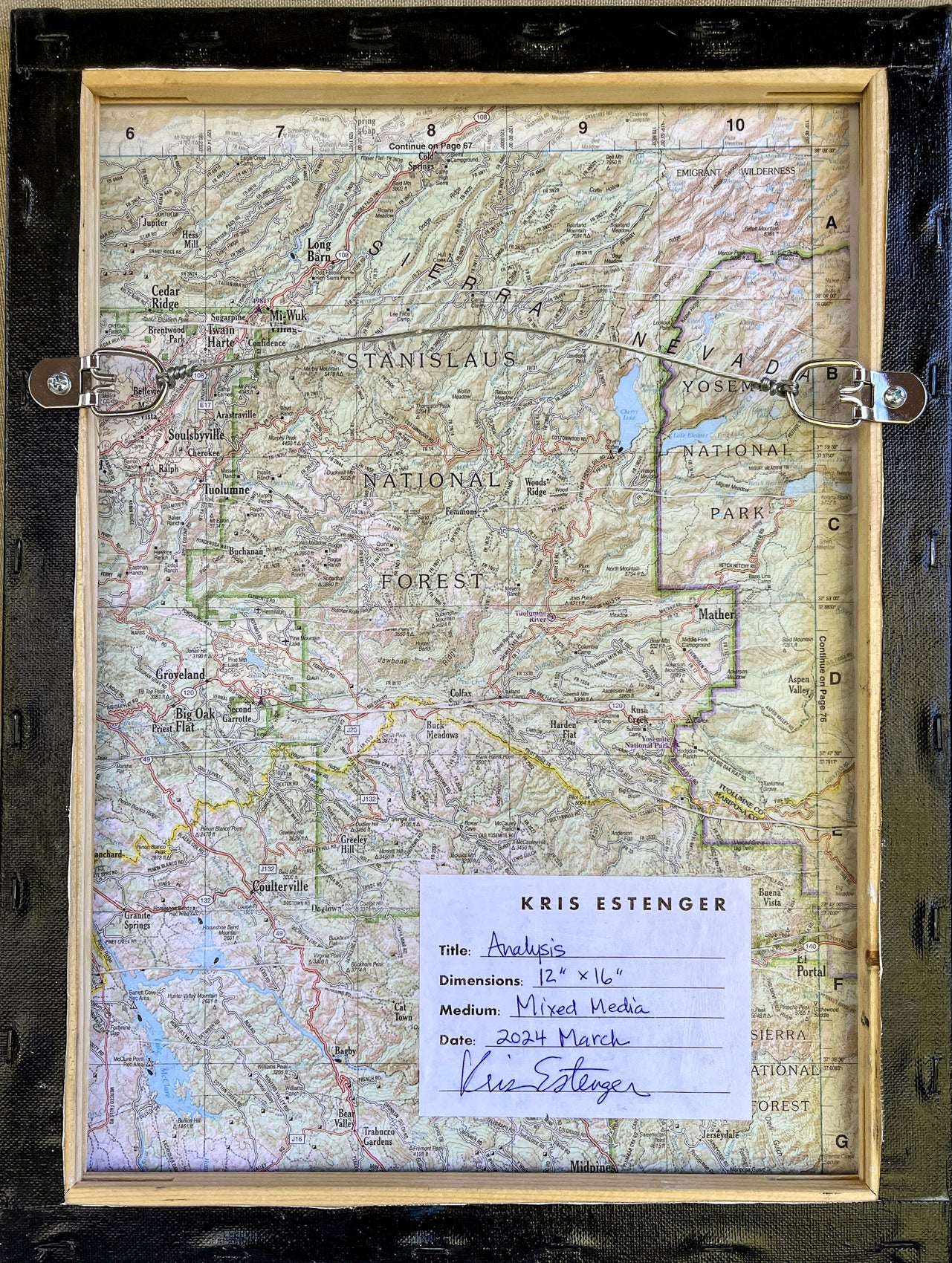 Back view of Analysis shows an old map and tag with artist and artwork information. The piece is wired to hang.