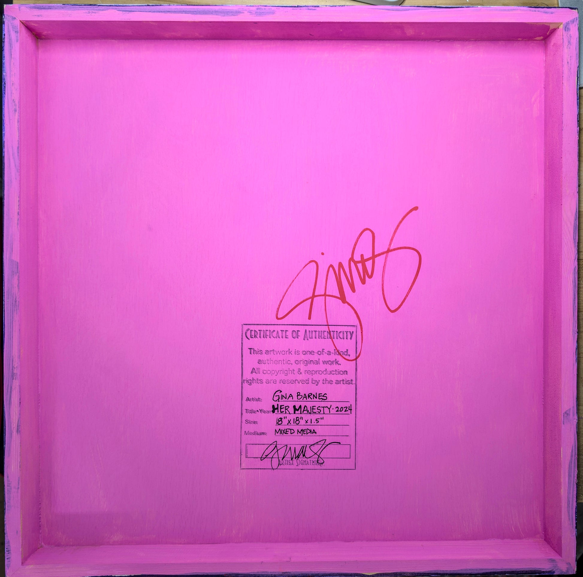 Shows the back of the painting - which is painted bright pink and comes with a stamped Certificate of Authenticity and artist signature.