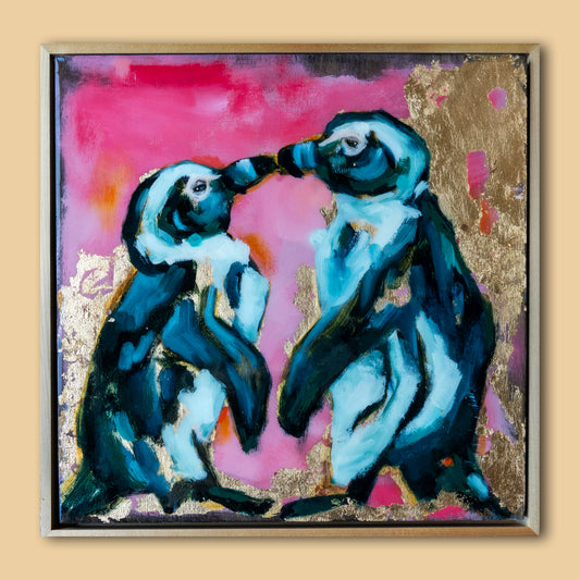 12.5"x12.5" painting of two Penguins is mixed media; using acrylic and oil, pencil, and gold leaf with glossy resin finish on surface; blues, pinks, and gold; artist Shaney Watters; has raw maple float frame