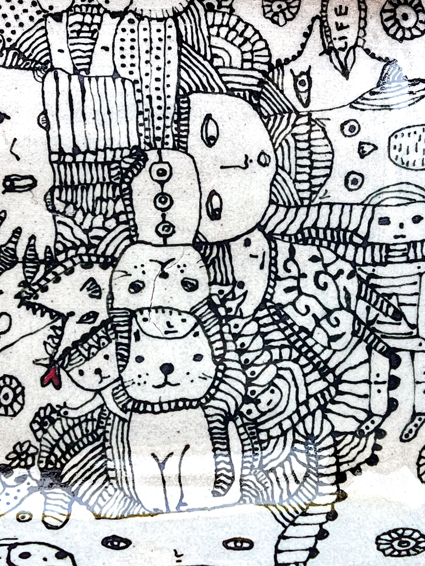 Black and white line art with abstract shapes and patterns is shown here in a zoomed image. There are faces of people, animals and whimsical creatures