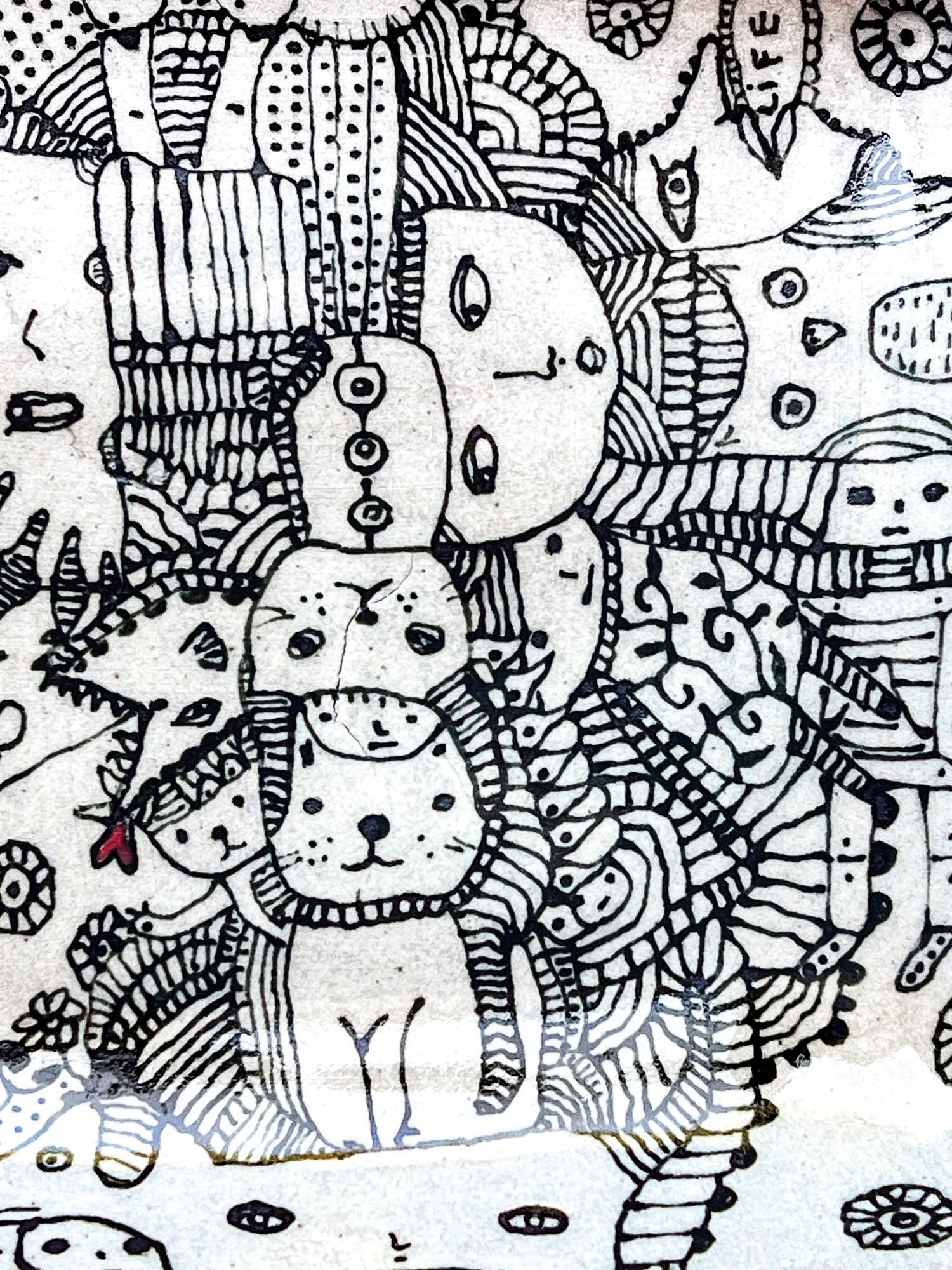 Black and white line art with abstract shapes and patterns is shown here in a zoomed image. There are faces of people, animals and whimsical creatures