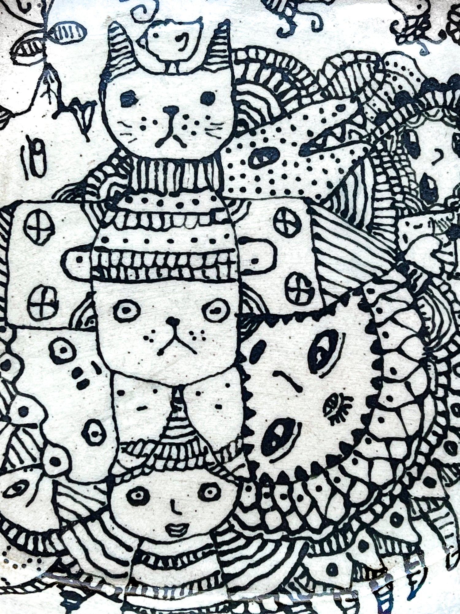 Black and white illustrations art of cats wearing hats with intricate patterns. This is a zoomed in image to show the detail.