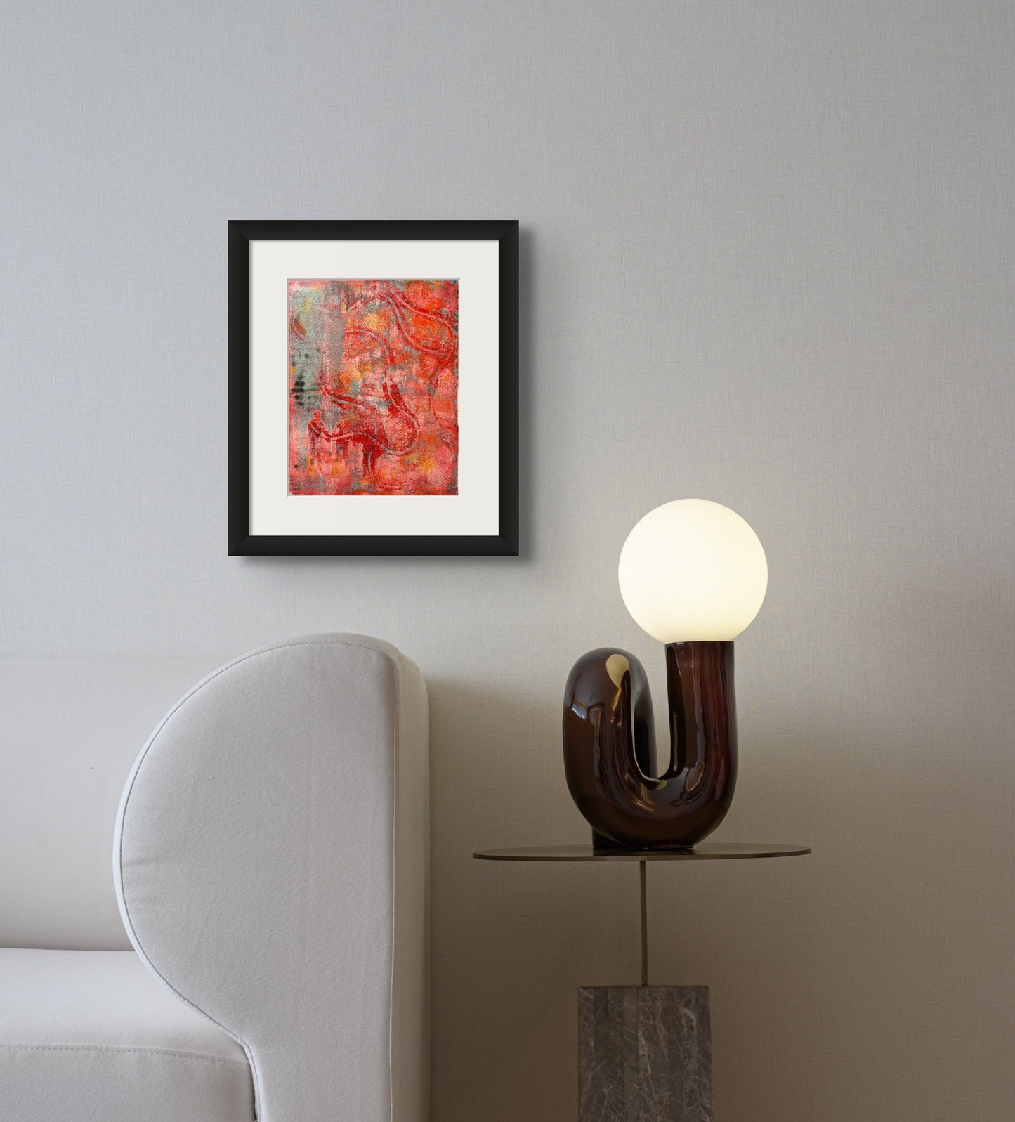 Colorful acrylic abstract print using reds, oranges, and pinks; artist Bob Hogue; shown with white frame in situ