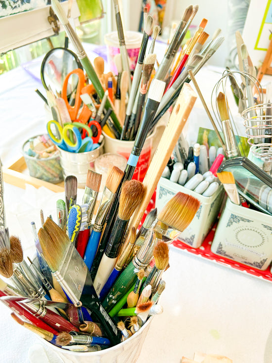 Images of artists' paint brushes and supplies