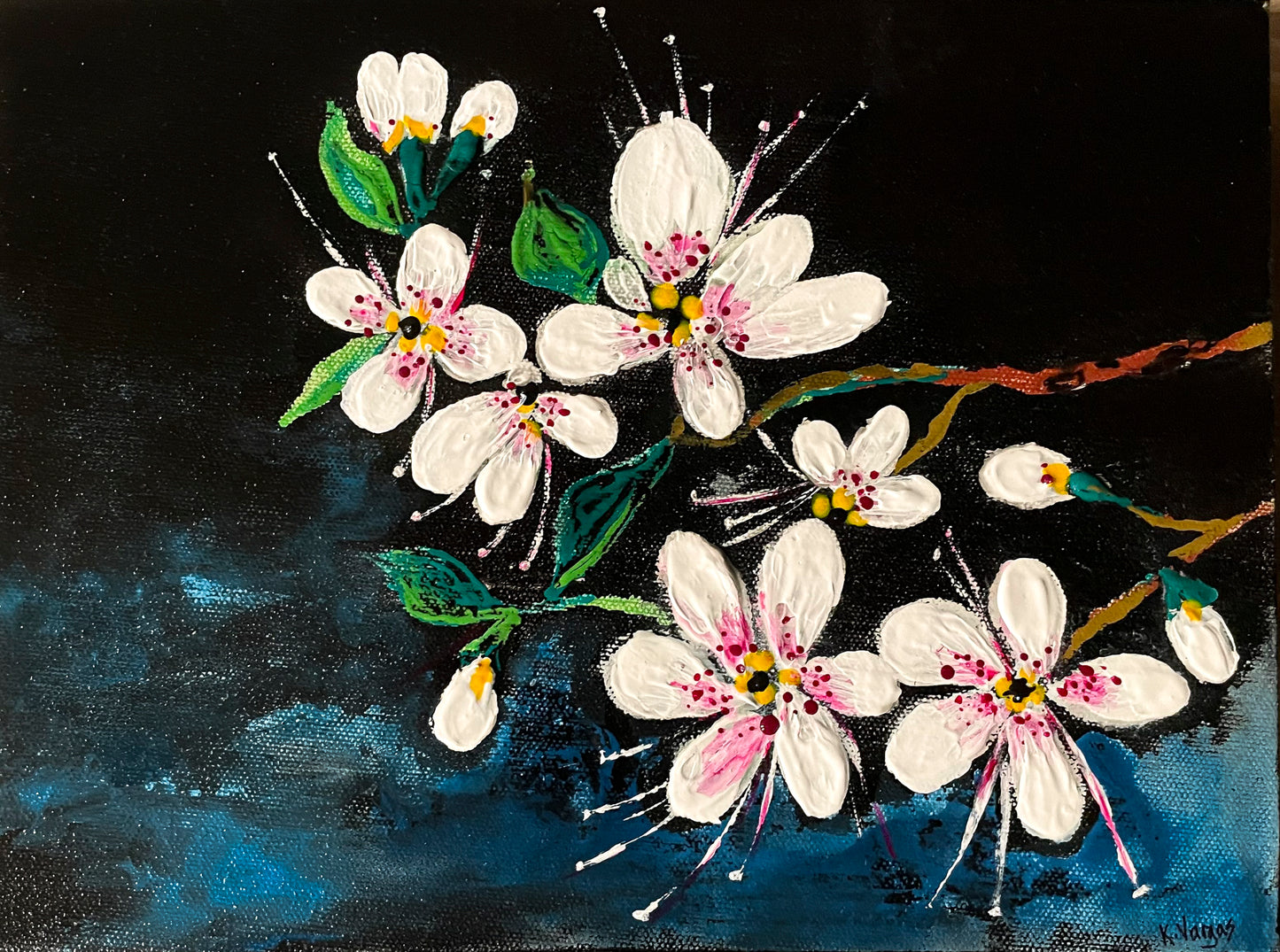 This beautiful piece features white petaled flowers with pink centers. Leaves and small branches hold the flowers together. 