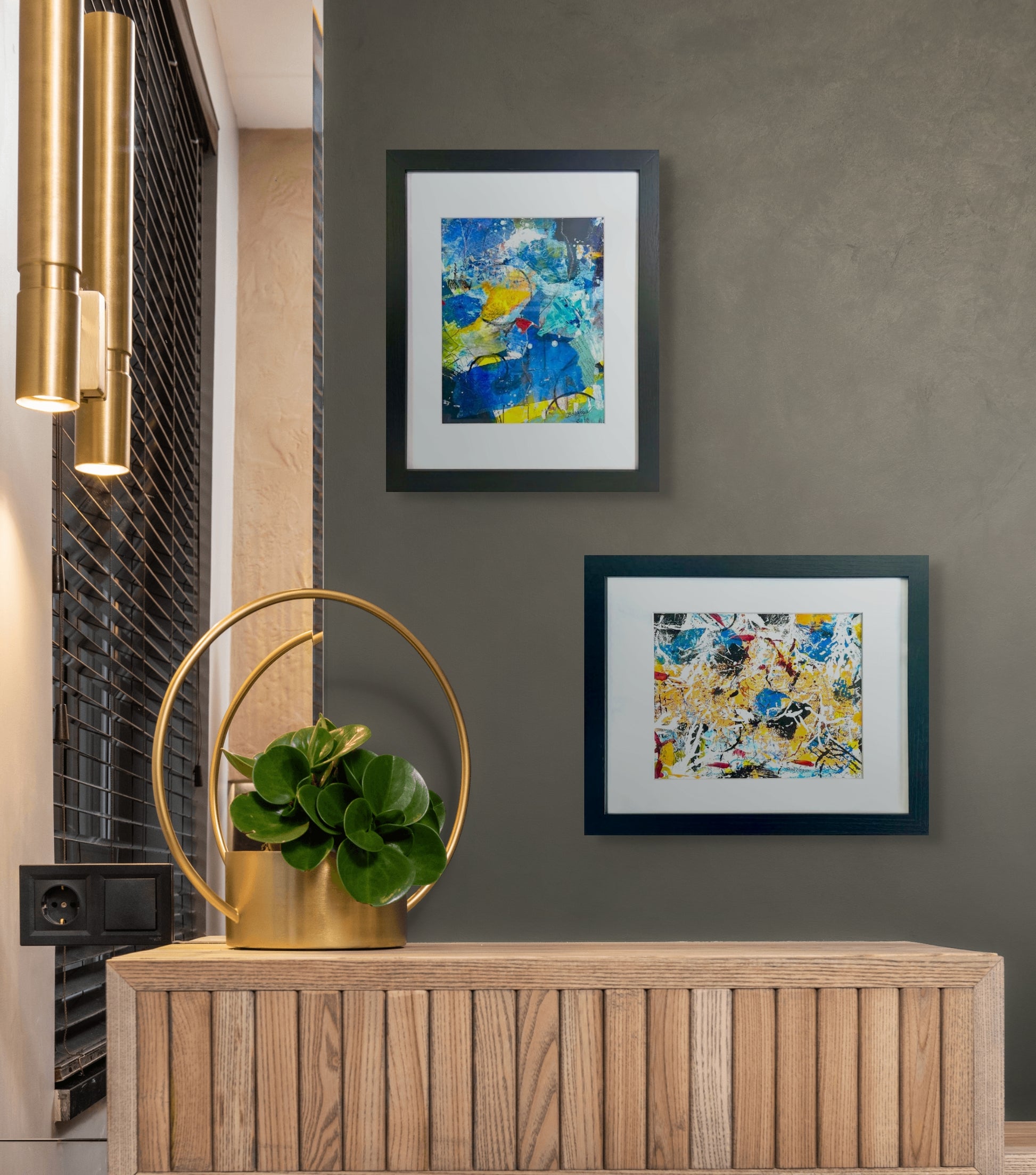Colorful abstract painting using acrylic; predominant blue, yellow, and white; artist Bob Hogue; 8"x10" and w/black wood frame and white mat 11"x 14"; shown in situ w/a second abstract painting by the artist