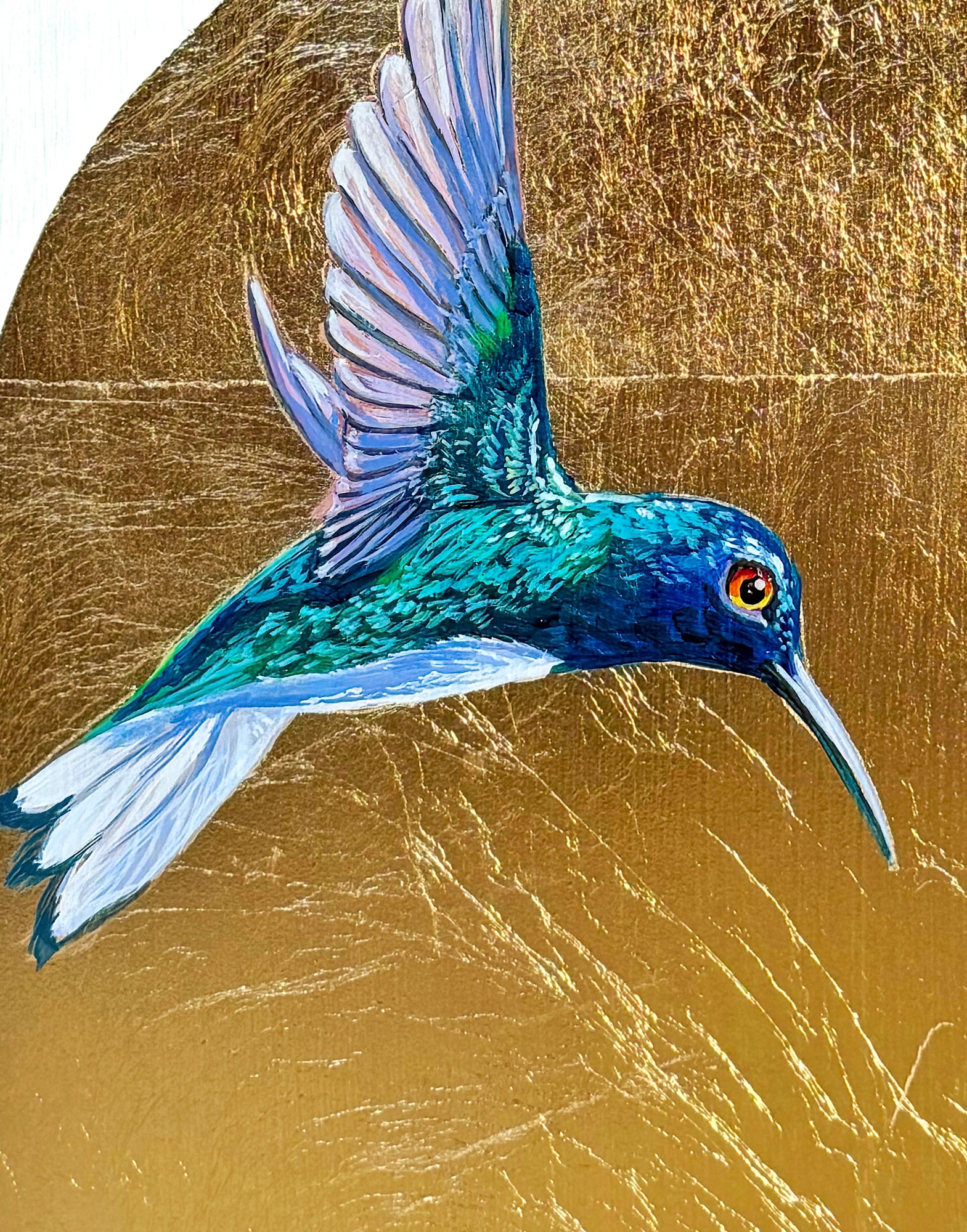 Closeup of a colorful male hummingbird looking at another from separate corners of painting; arch-shape background of gold leaf; 8"x8"; artist Marie Lavallee