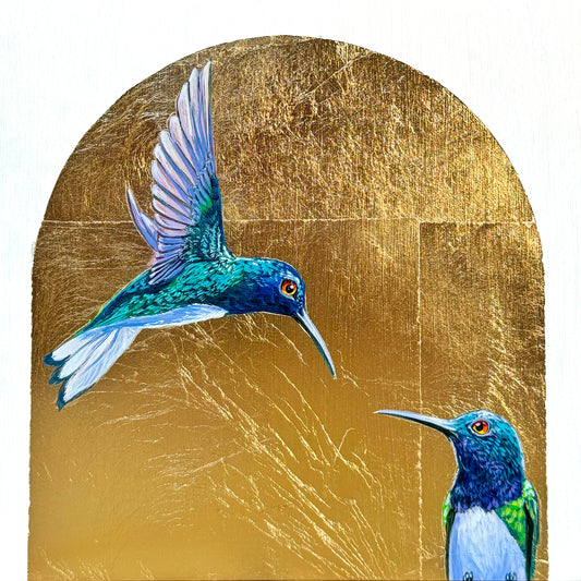 Two colorful male hummingbirds looking at each other from separate corners of painting; arch-shape background of gold leaf; 8"x8"; artist Marie Lavallee