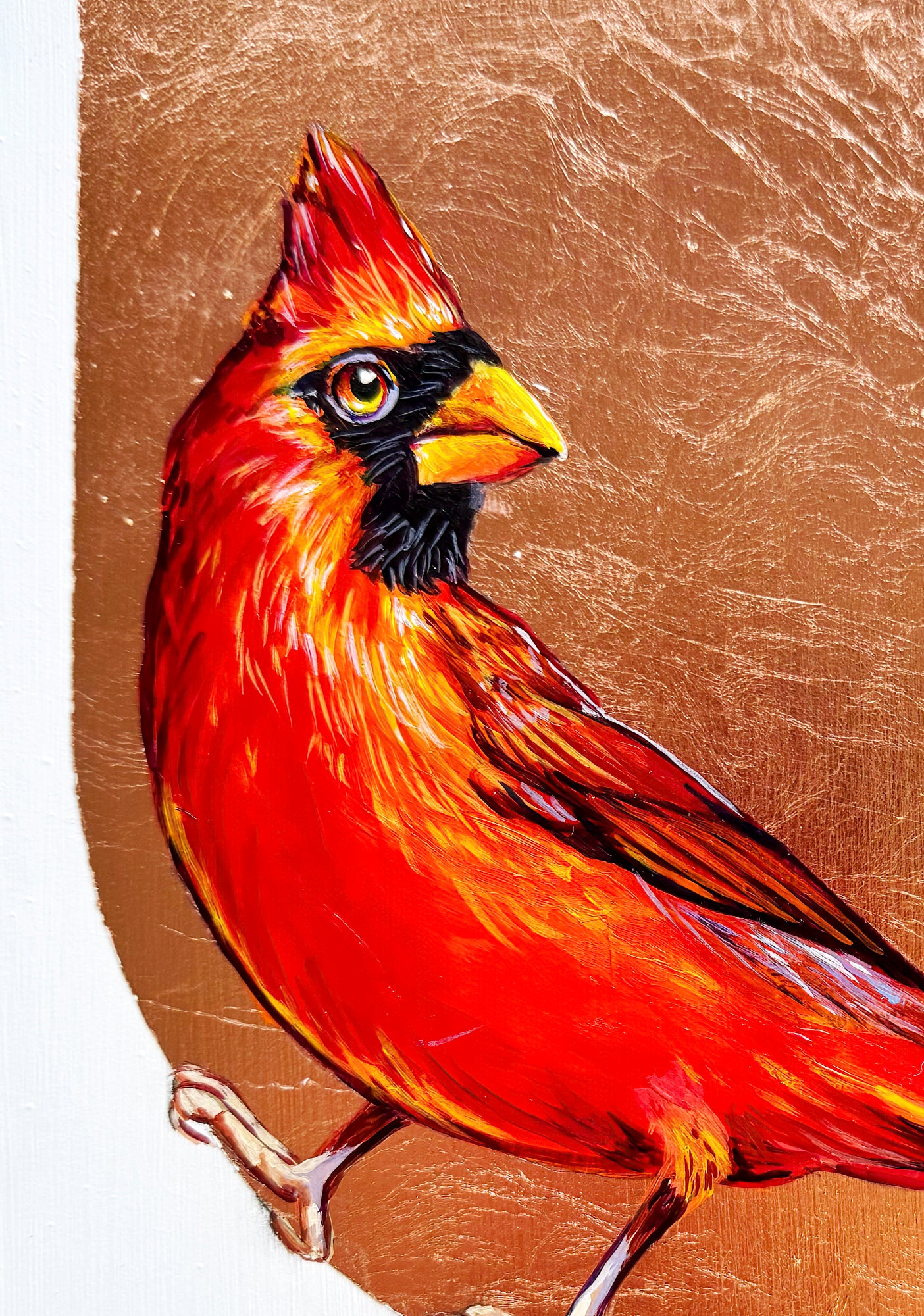 Closeup of a bright red cardinal clinging to a drop of copper leaf background; 8"x8"; artist Marie Lavallee