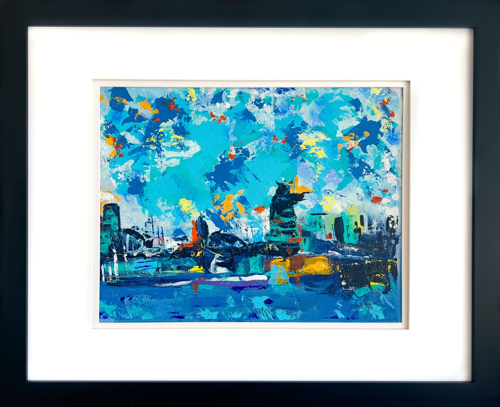 Colorful abstract painting with a blue palette with hints of yellow, red and whites. The image, though abstract, resembles a city skyline; artist Bob Hogue; shown with white mat and black wood frame;