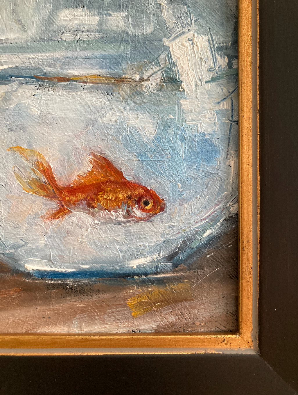 Corner detail of oil painting of goldfish swimming in round bowl with frame