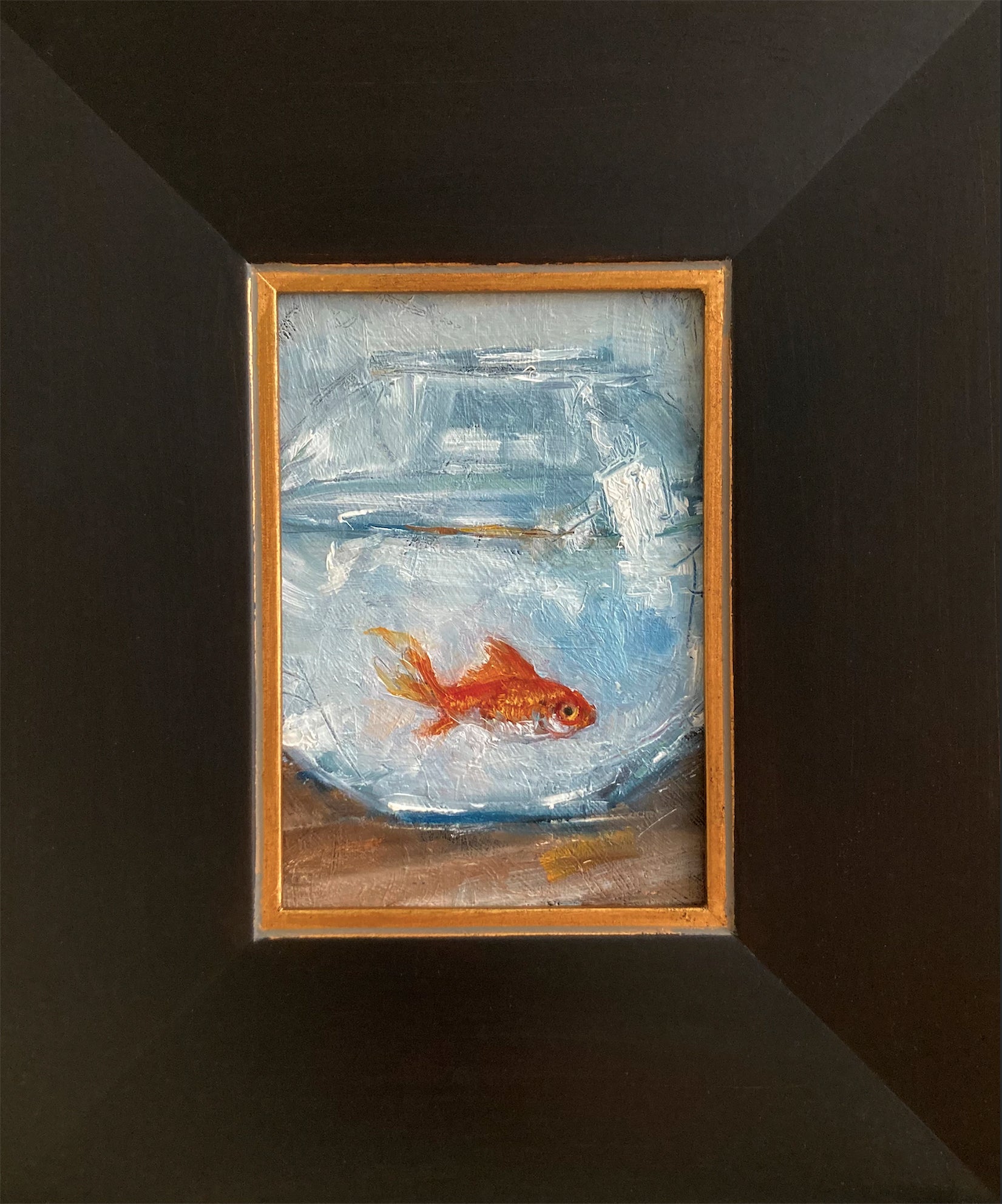 Oil painting of goldfish swimming in round bowl with dark wood frame with gold trim