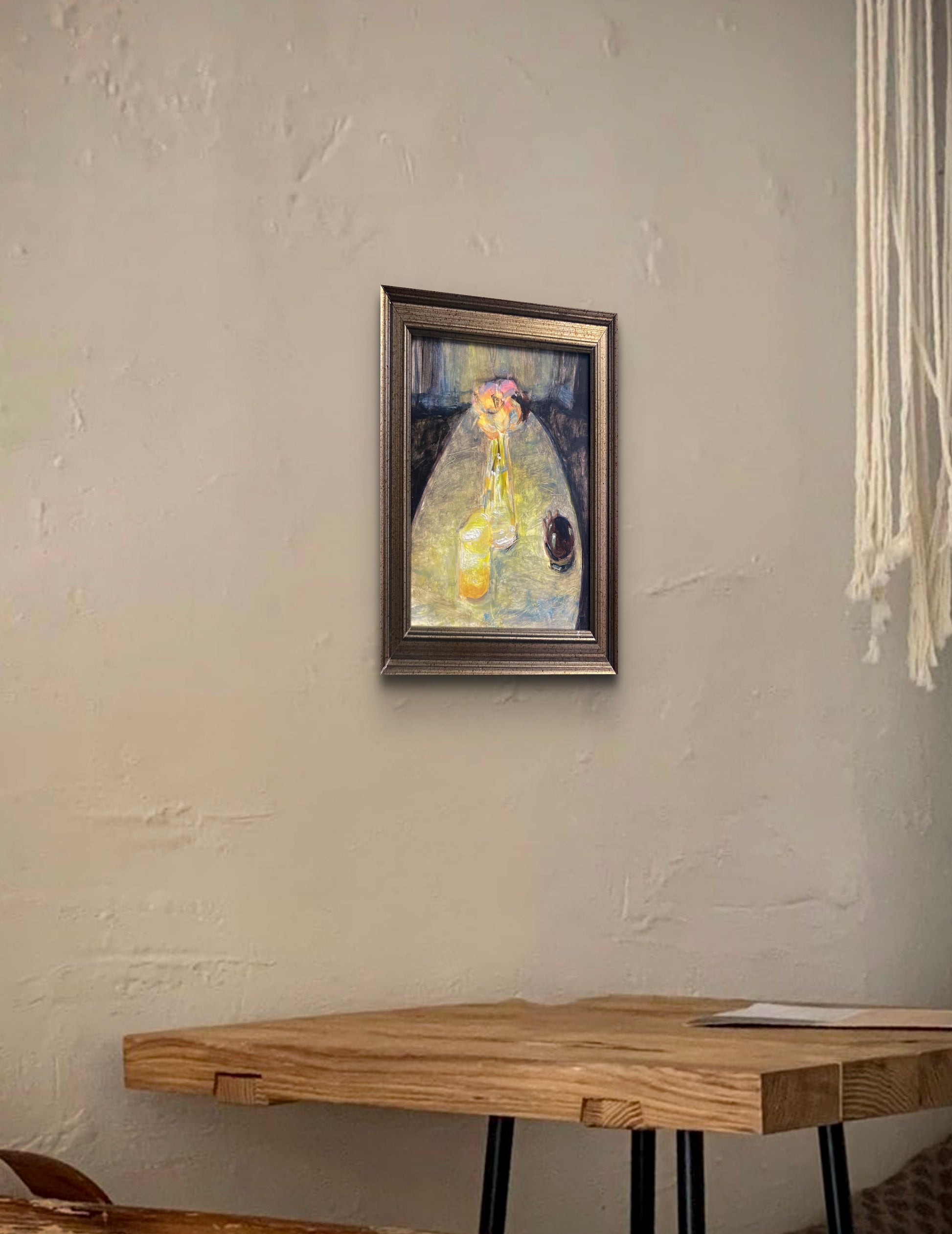Oil painting of flowers in vase and drinks on table in yellow and gray shades titled 'Low Light' by E. E. Jacks in situ