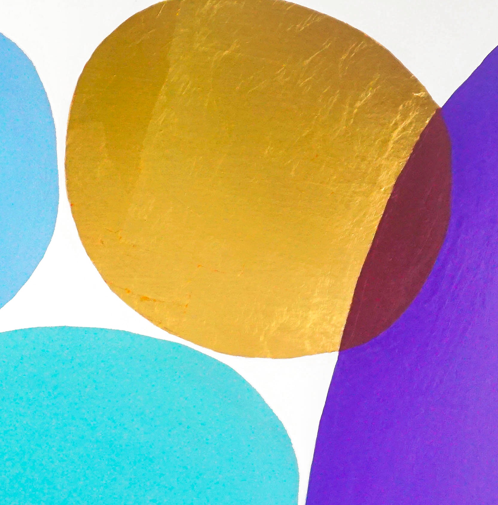 This image shows a close up of the colored ovals in blue, teal, purple and gold leaf. The gold leaf and purple ovals intersect to form a deep red. 