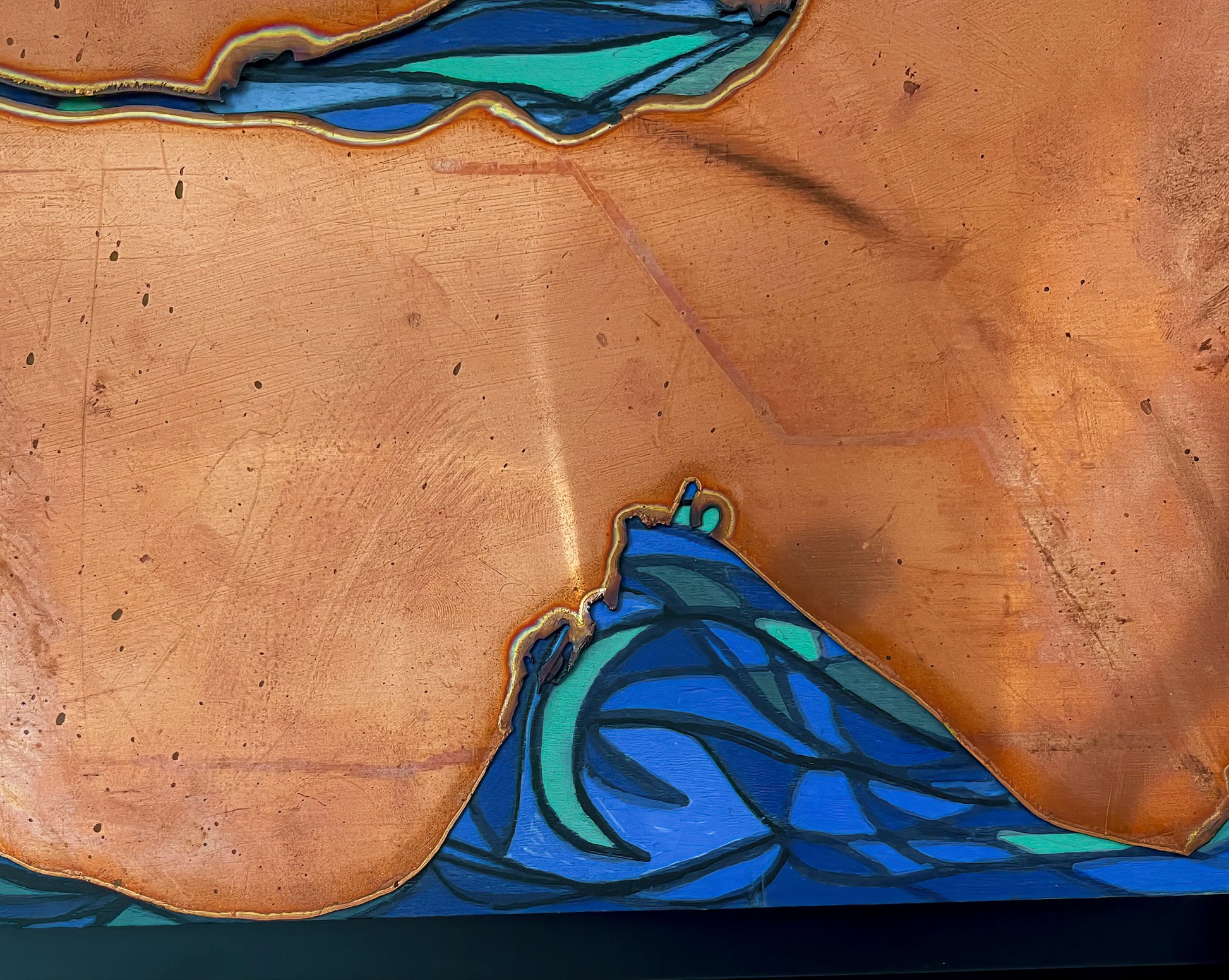 Another close up of the copper sections adjacent to the blue tones of the water.