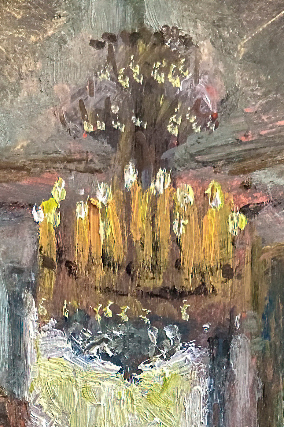 A close up image of the burning candles on the chandelier.