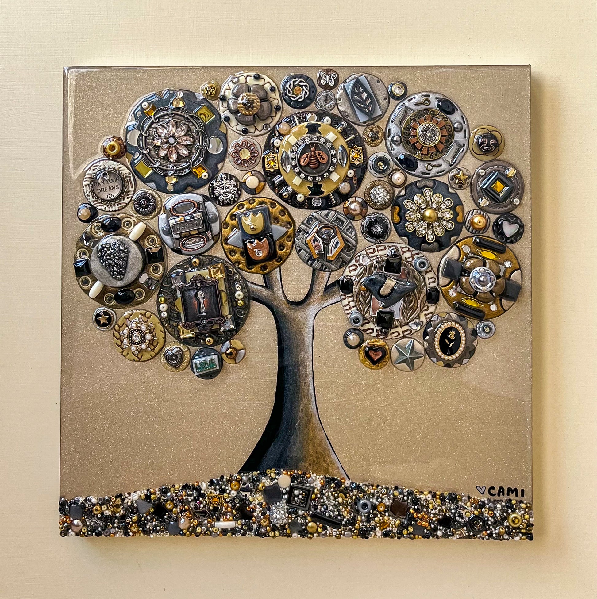 This piece is all in metallic colors, gold, silver, copper and bronze. It is a tree filled with detailed clay circles, each one unique. gemstones, and sparkles adds to the impact. 