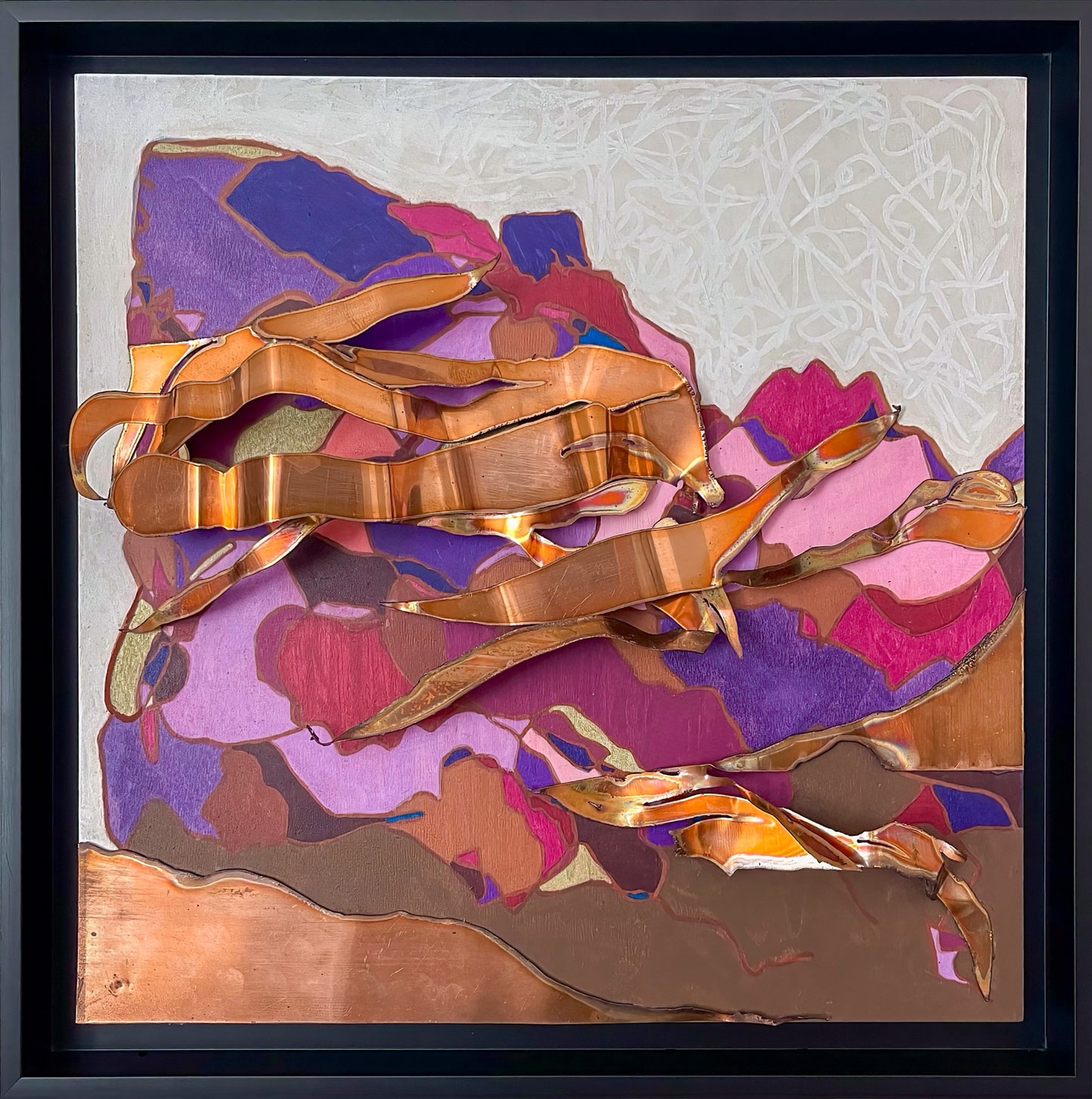 Switchbacks includes a background of gray patterned with twisted white lines. The main portion of the work is a three dimensional placement of copper pieces that represent mountain switch backs shown in hues of purples, reds and browns. 
