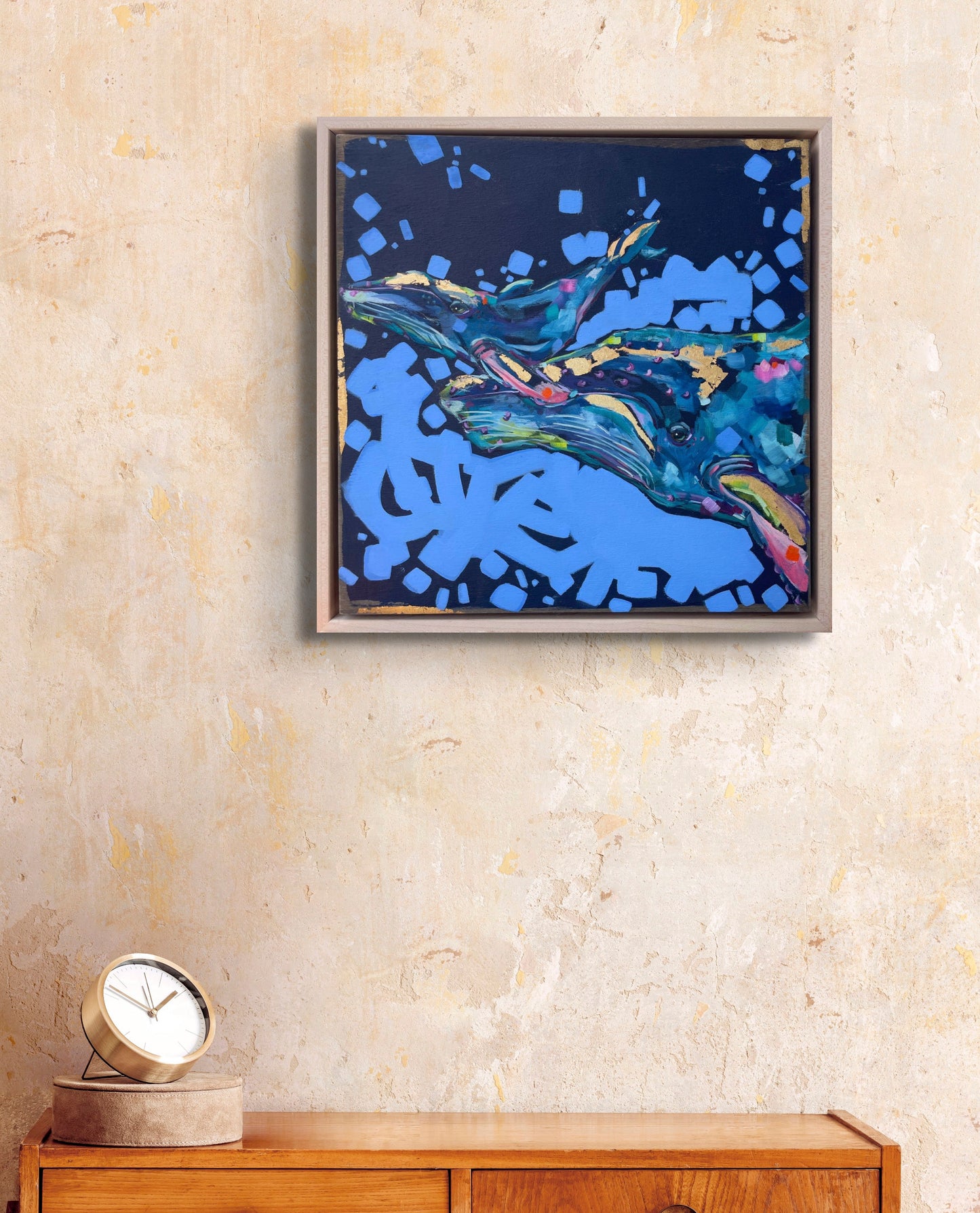 Oil painting of abstract whales in blue shades with gold leaf detail titled 'Everything Whale be Okay' by Shaney Watters in situ