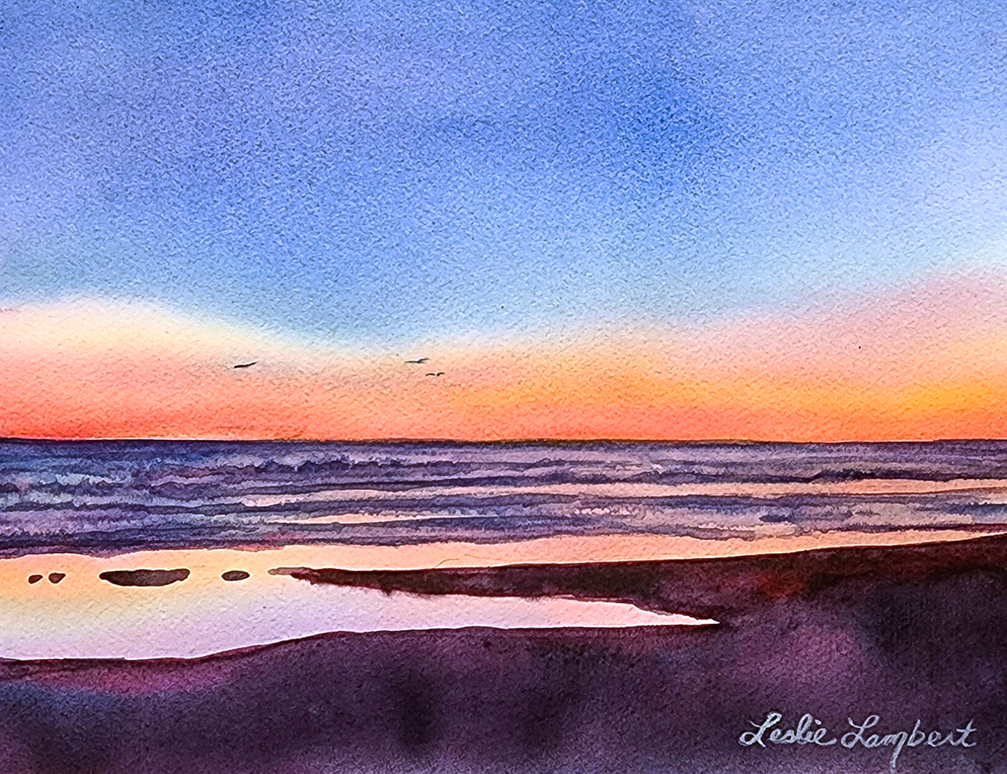 This painting captures a royal blue sky highlighted by an orange sunset over an ocean with soft waves. The color of the water, impacted by the suns reflection, look metallic. Seagulls fly in the distance.