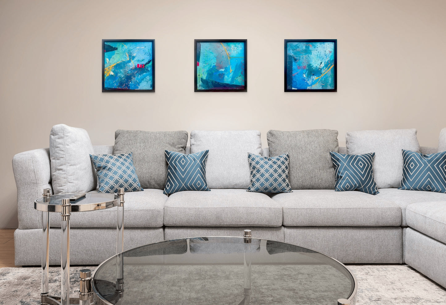 The Blue Series works beautifully together, shown here hanging over a comfortable couch with blue pillows.