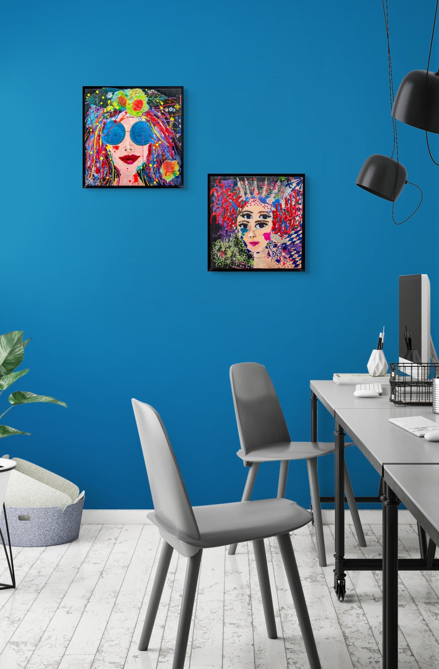 Two Whimsy Girls, Mini Me and Double Vision hang on a blue wall in a modern office setting.