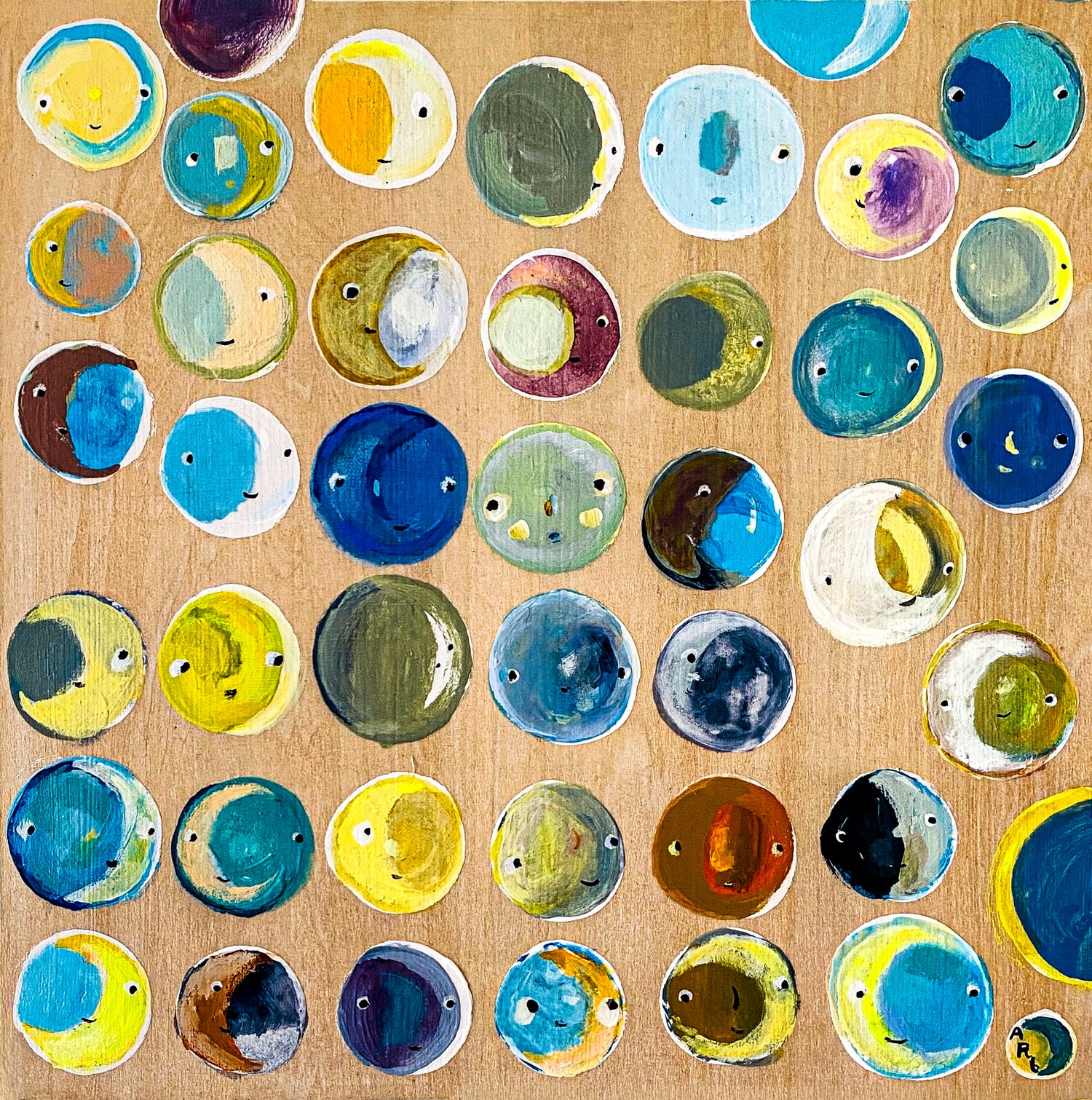 This painting features a pattern of many moons of many colors and faces. The moons are arranged in a random pattern in tones of blues, yellows, teals and greens. 