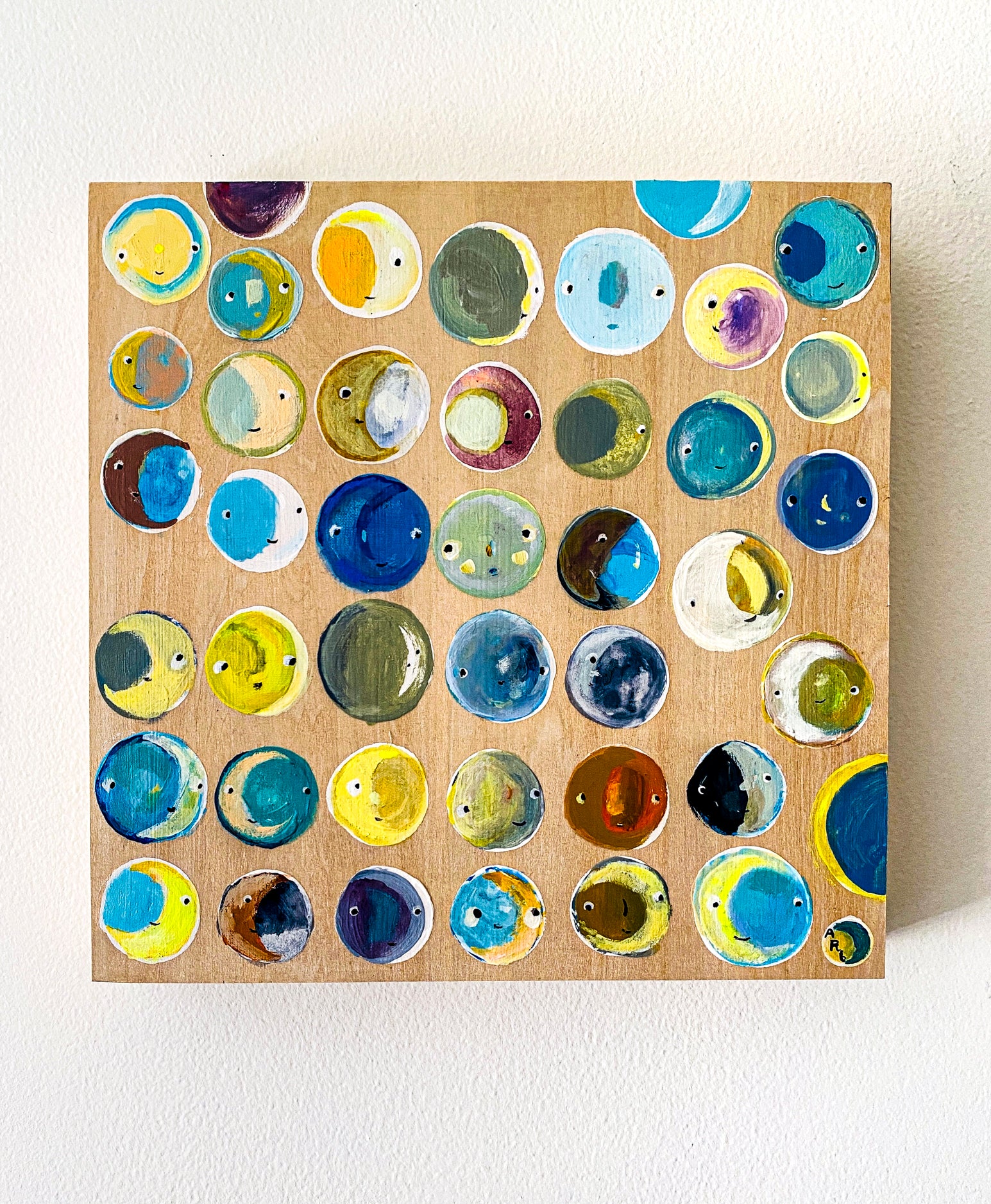 This image shows the painting hanging on a plain white wall. The painting requires no frame. 