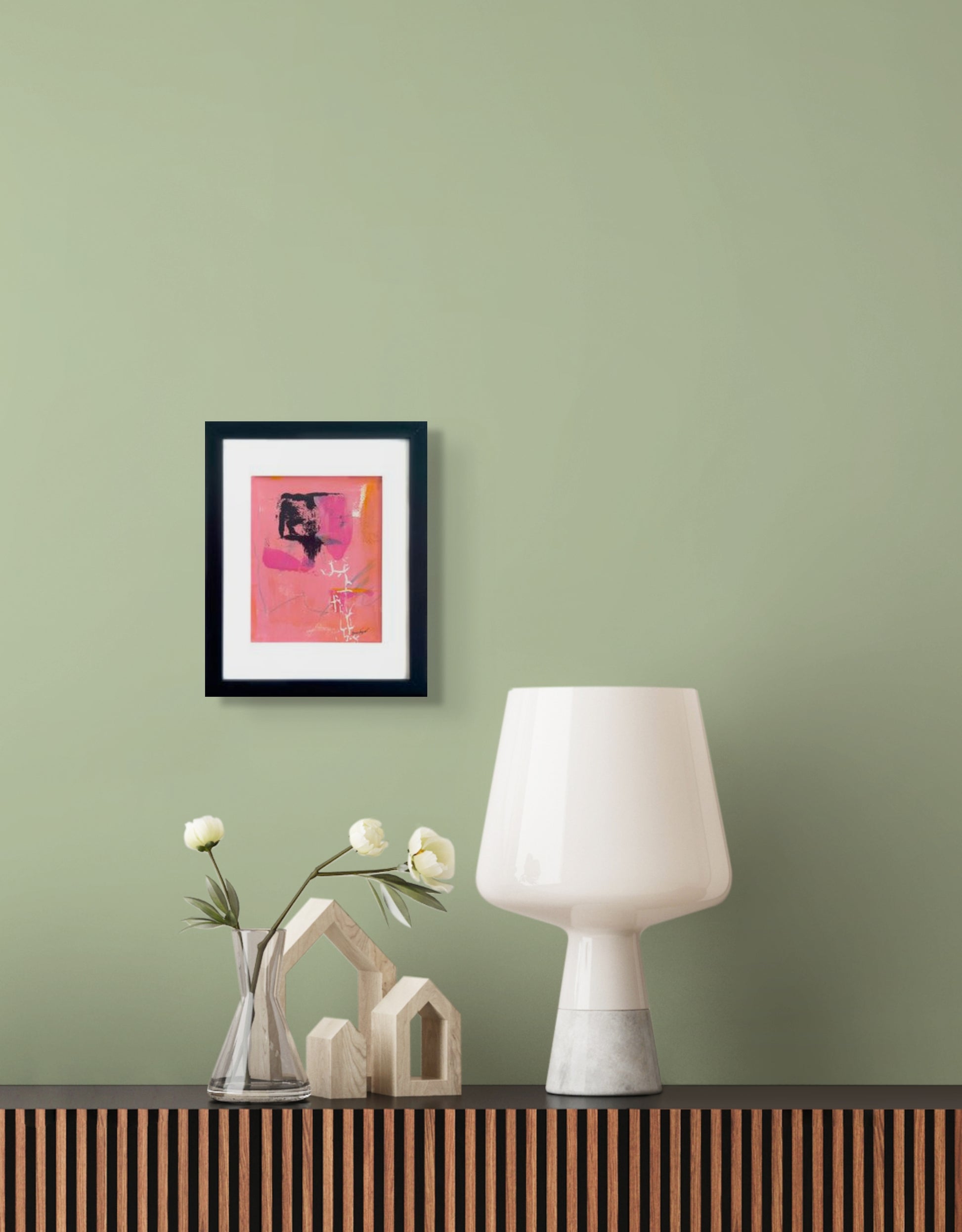 Colorful abstract painting in pink and orange hues with stenciled white markings and black contrast elements; artist Bob Hogue; shown in frame w/white mat and black wood frame in situ