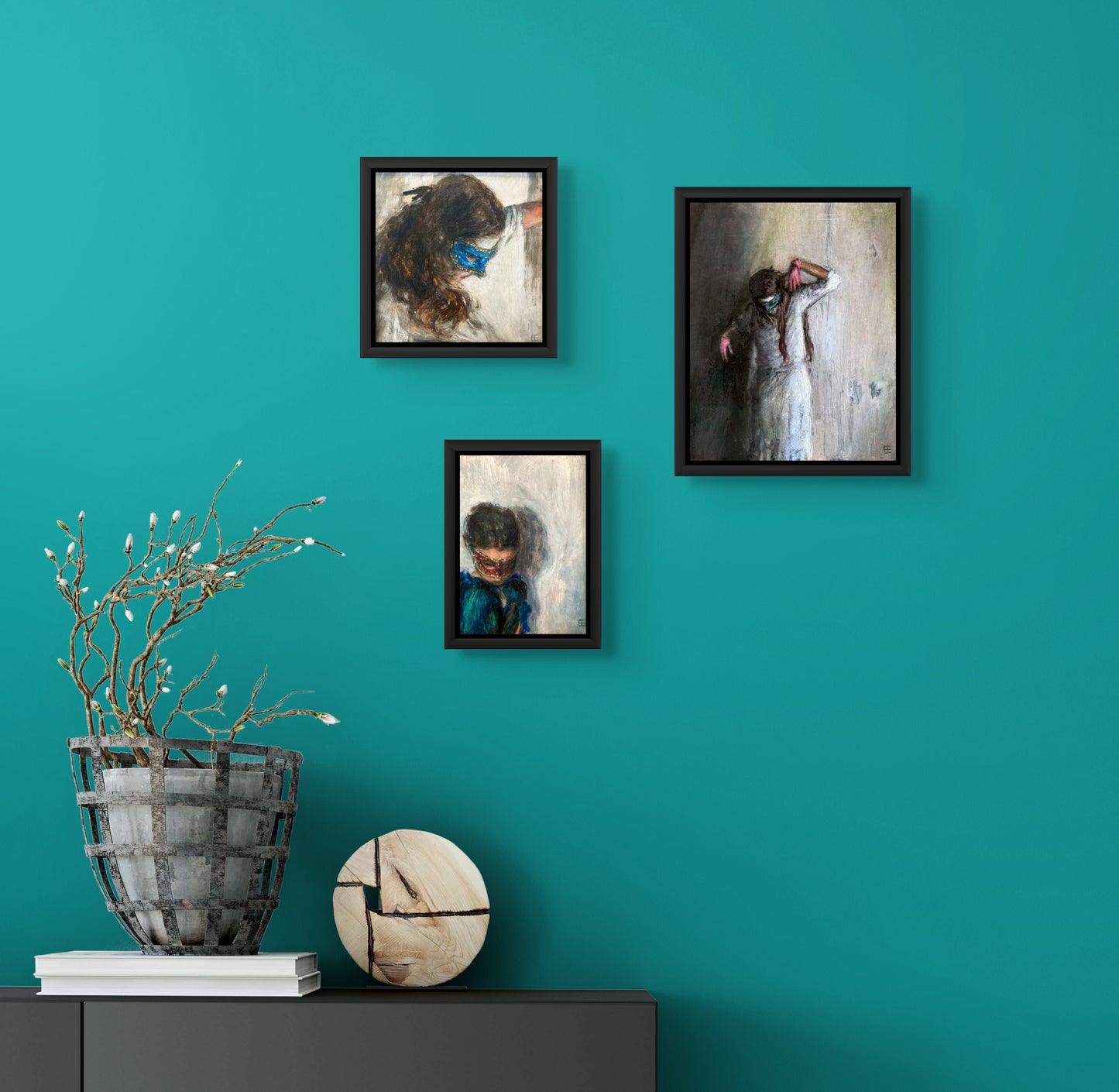 Oil painting of a woman in blue wearing a red mask with eyes cast downwards against an off-white background; E. E. Jacks artist; shown in situ with paintings of two other masked women;