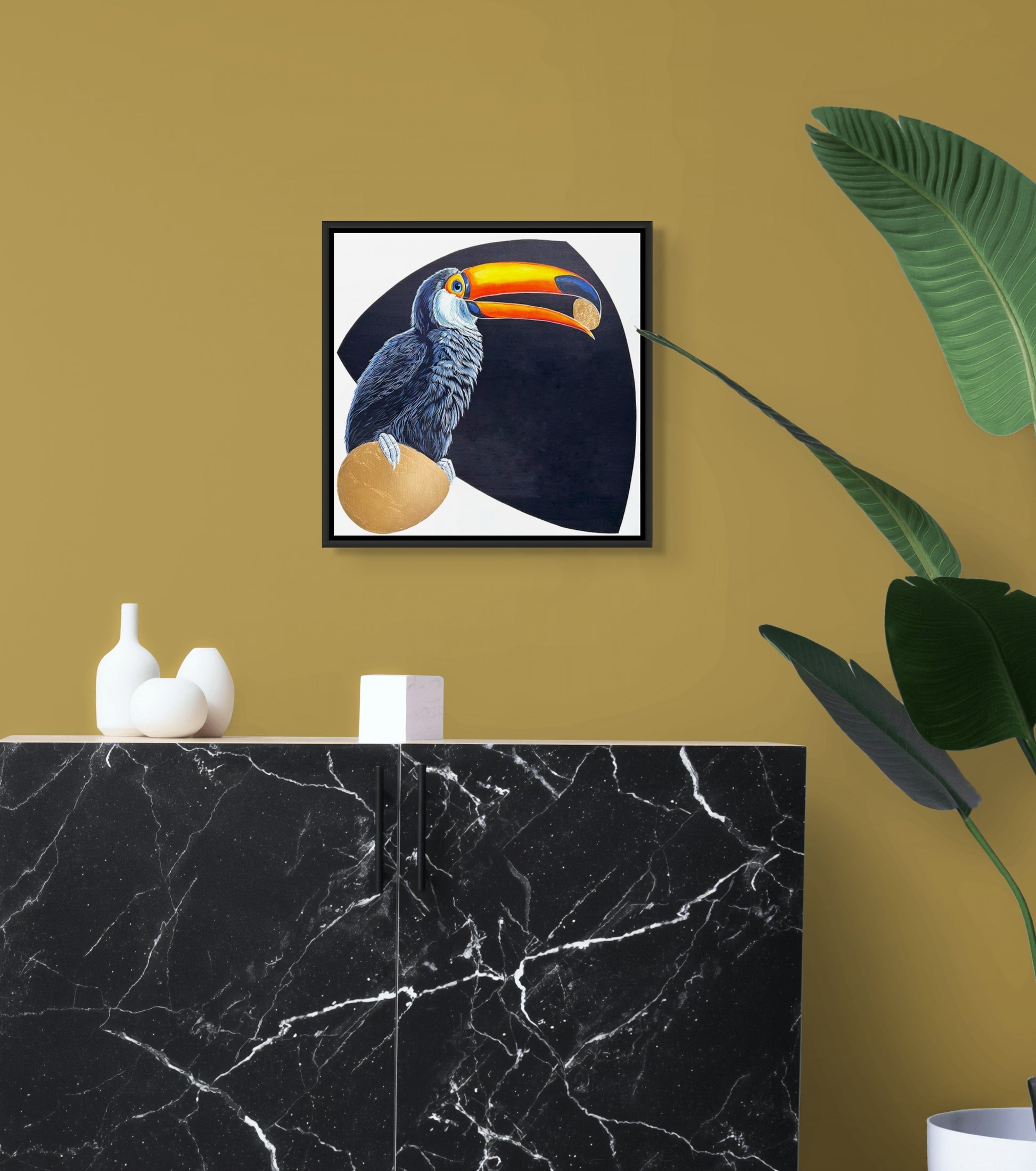 This is an in situ image of "The Offering" show hanging above a granite counter on a gold hued wall.