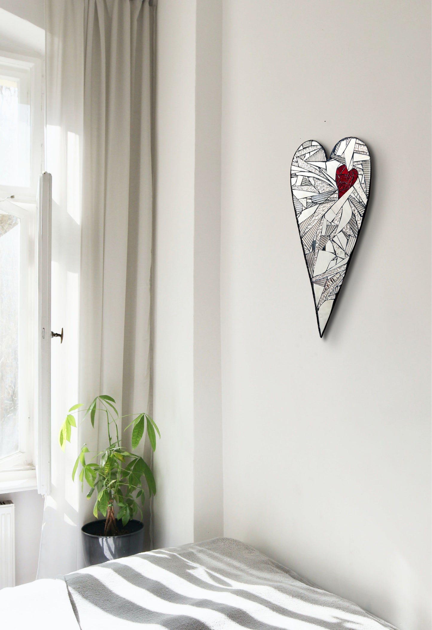 Heart-shaped mosaic made of mirrored-glass pieces with red mirror heart shape inside by Denise Marshall in situ - title 'All Heart!'